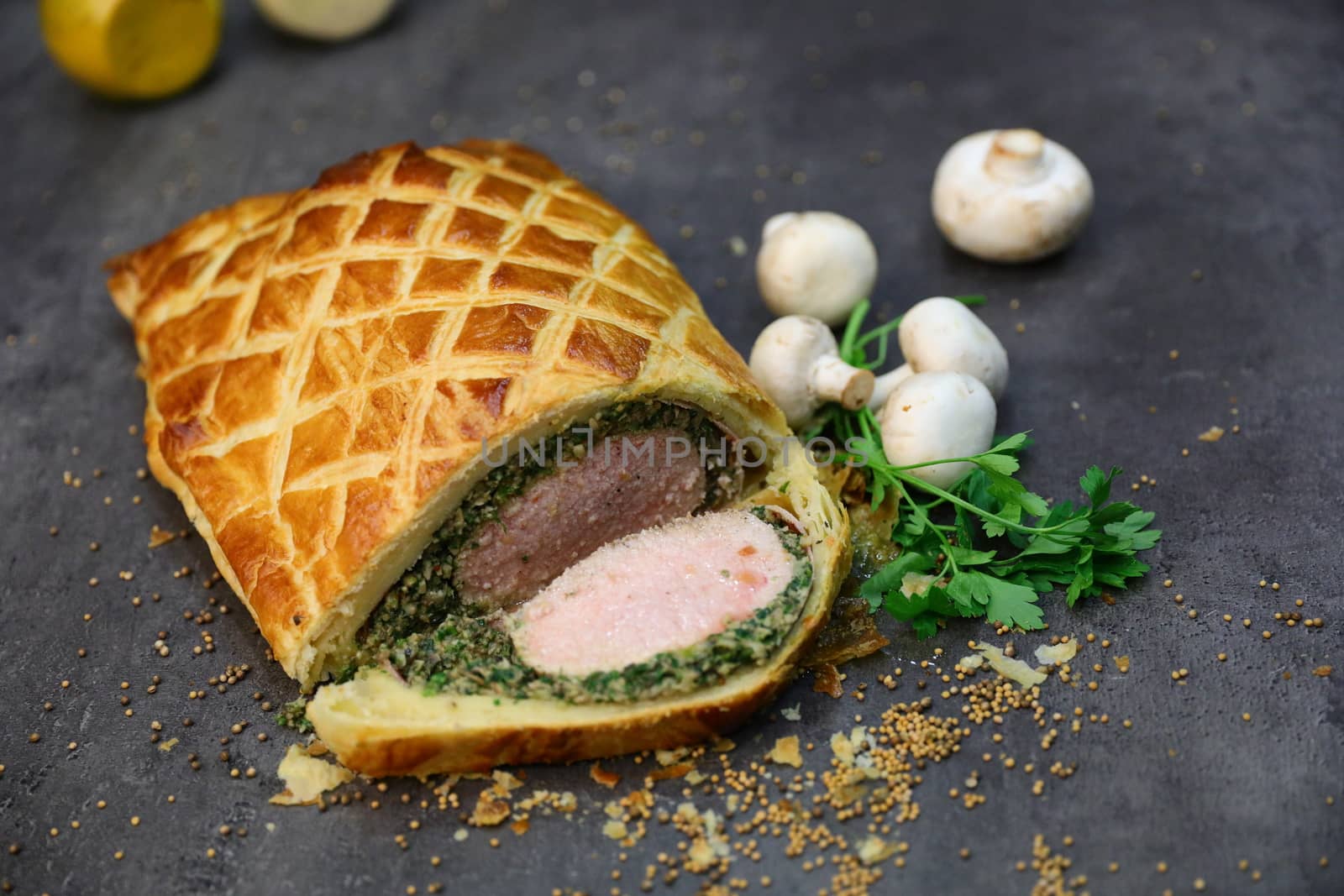 Fillet steak coated with pate de foie gras and duxelles, which is then wrapped in puff pastry and baked