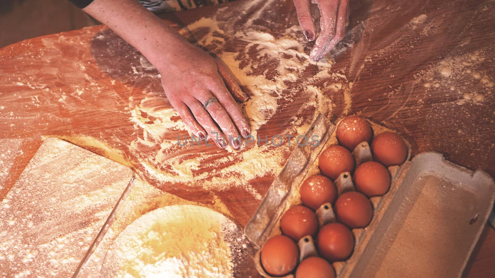 Close up scene of female hands making dough by natali_brill