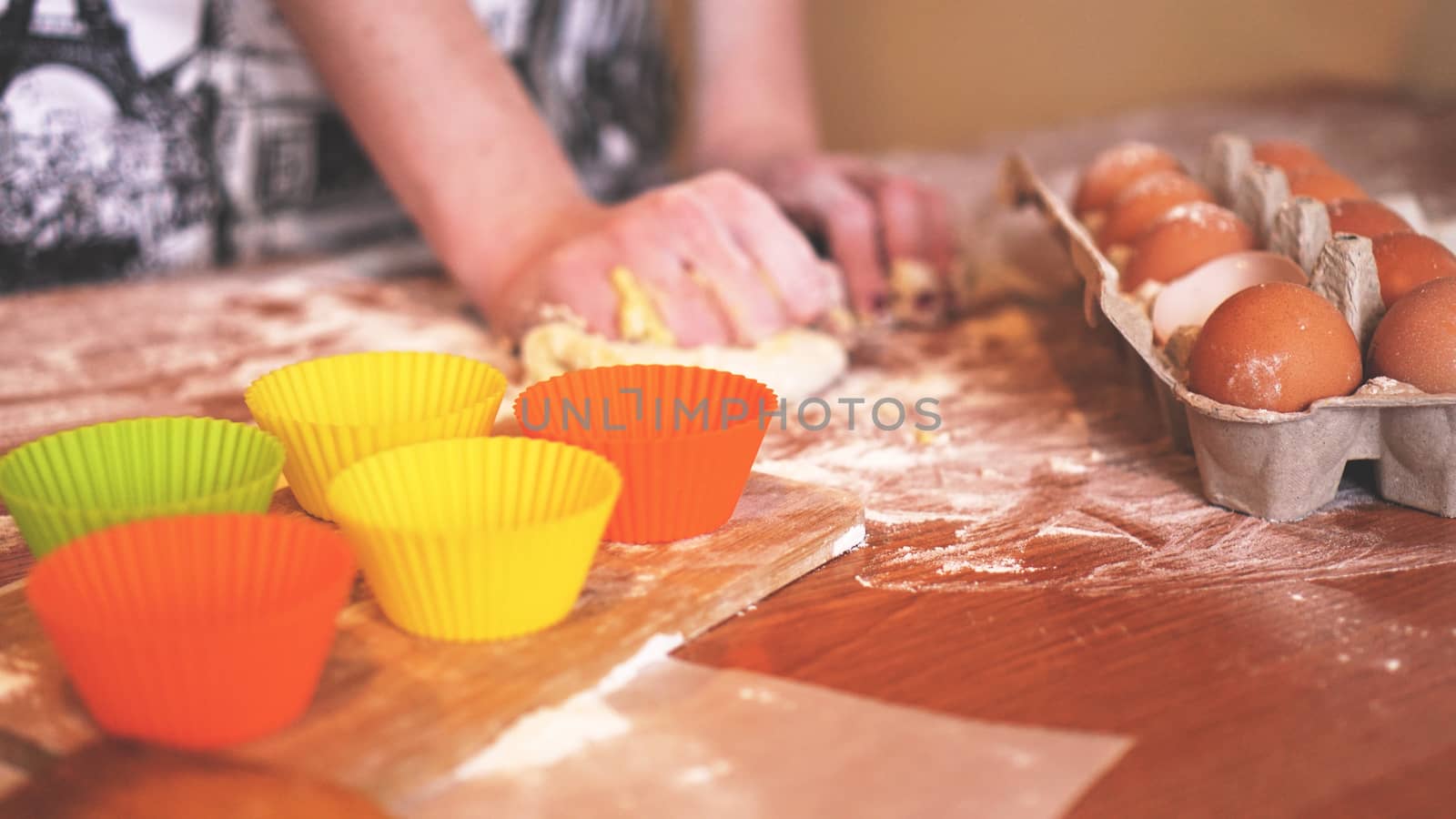 Cooking and home concept - close up of female hands kneading dough at home by natali_brill