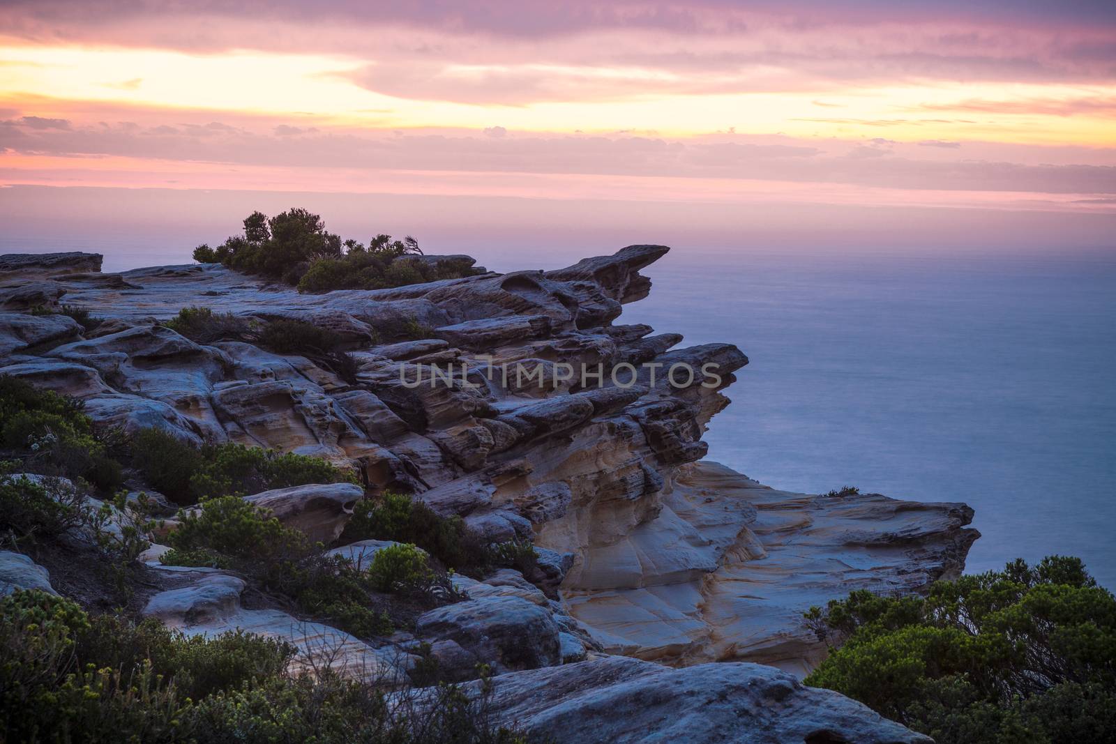 Dawn skies cliff coast Royal National Park by lovleah