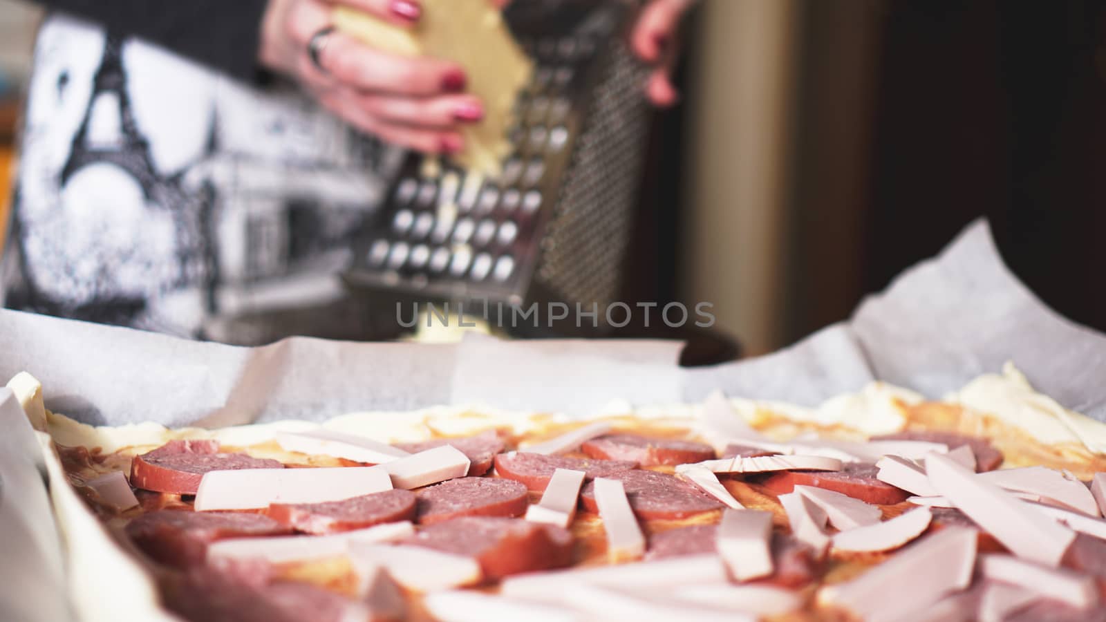 Closeup hand of chef baker making homemade pizza by natali_brill