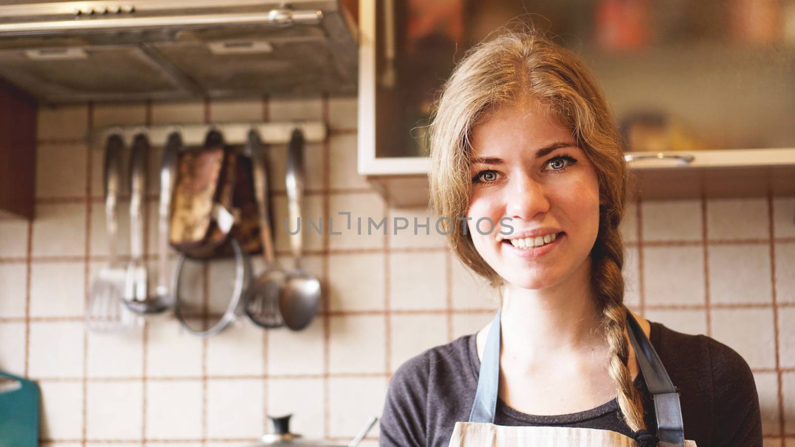 Portrait of beautiful woman at home in kitchen lifestyle by natali_brill