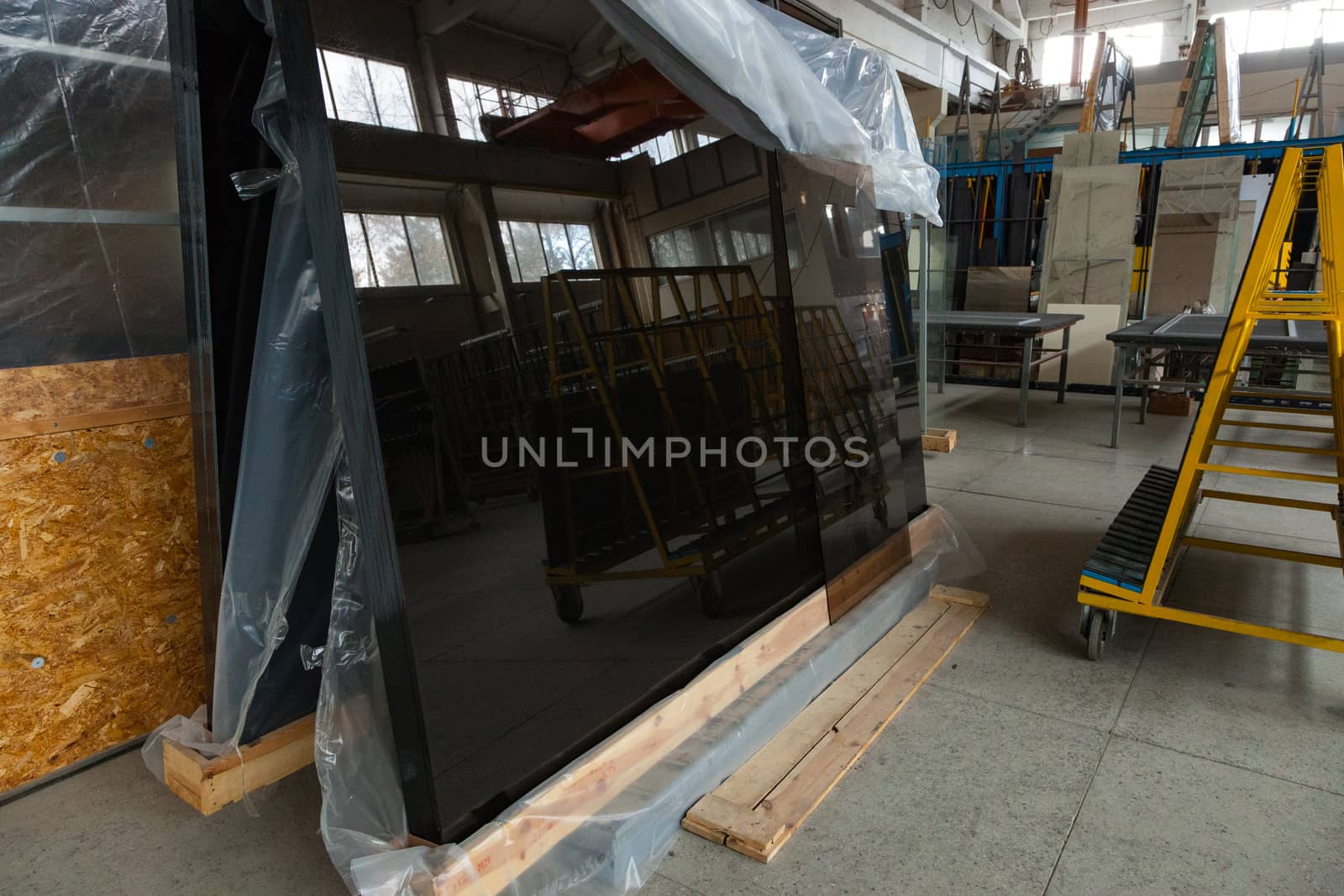The interior of a large glass and mirror cutting factory