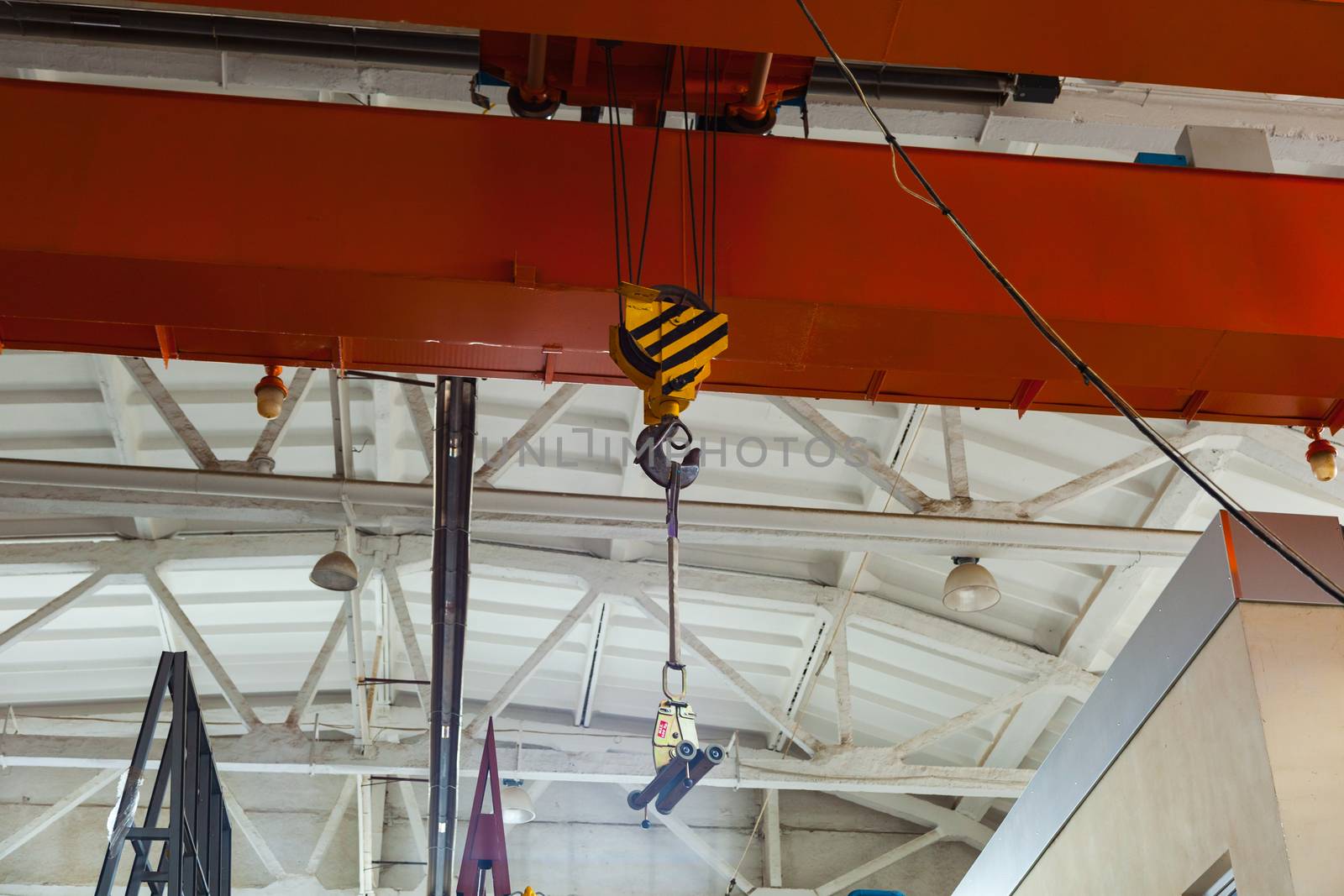Factory bridge crane for lifting cargo in an enterprise