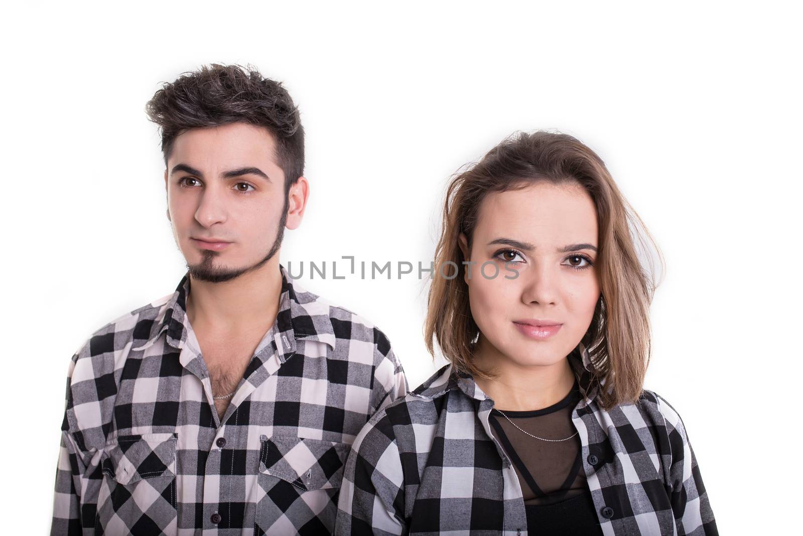 Girl and boy standing with shoulders close isolated on white