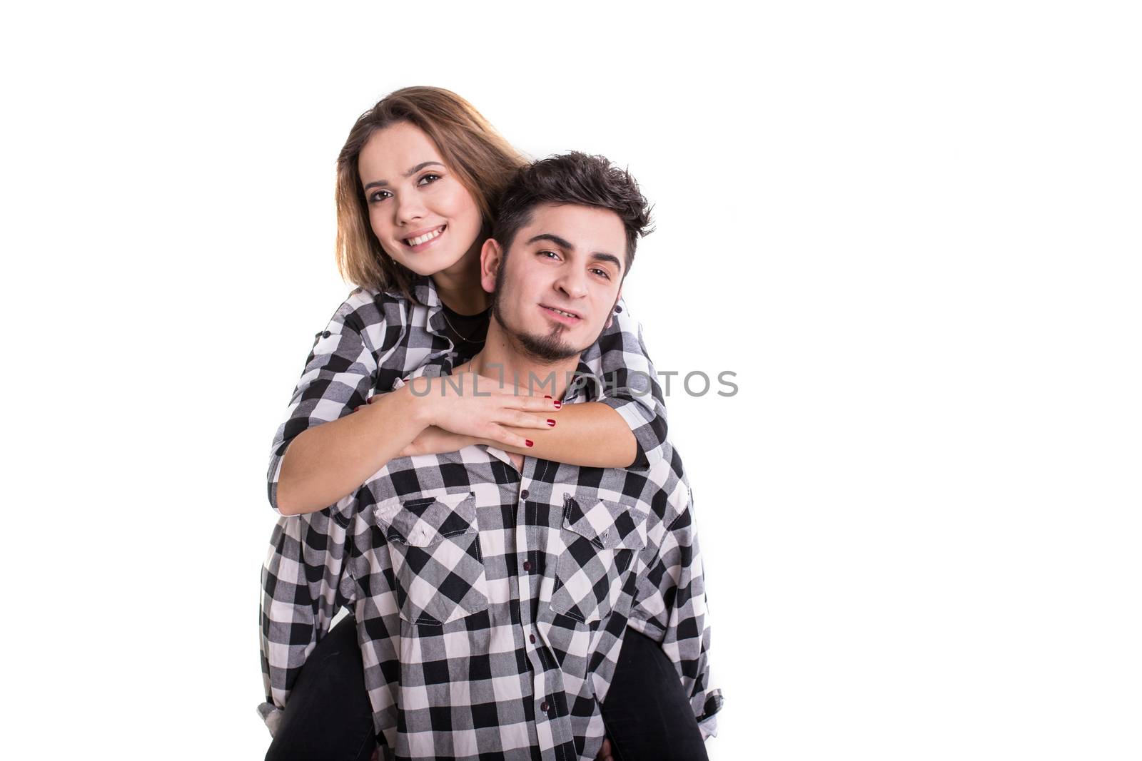 Girl on boy back in skirts isolated on white