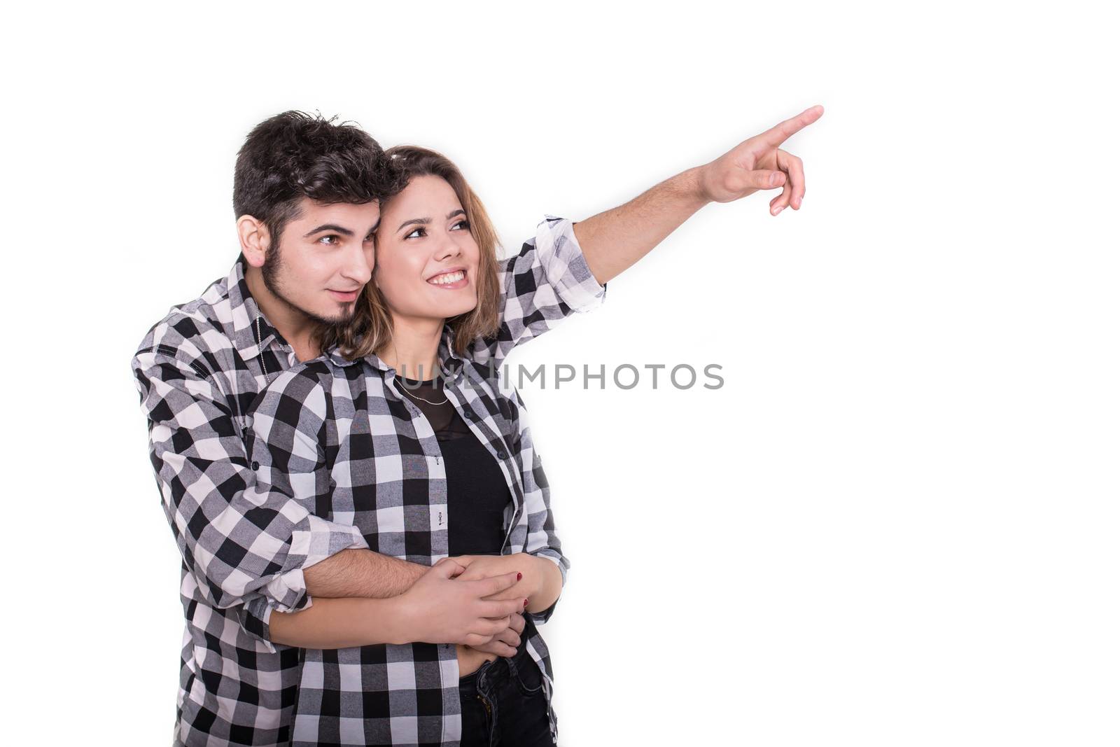 Boy pointing up showing something to girl isolated on white