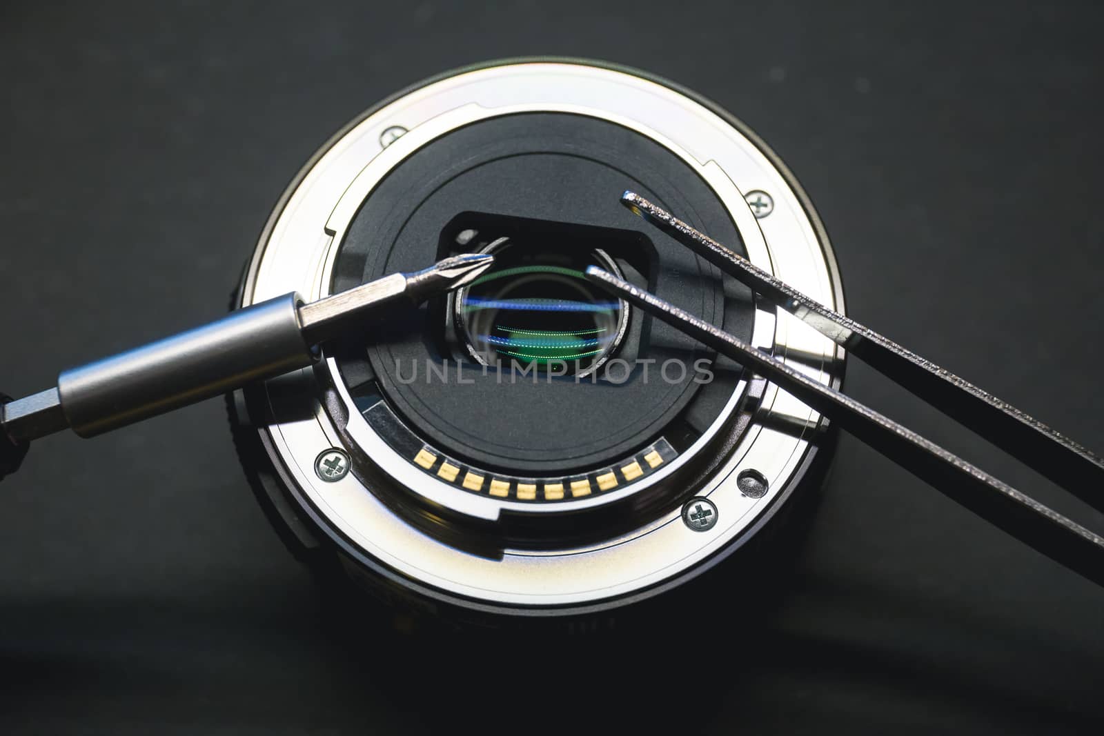 Disassemble and repair process of professional modern digital camera lens. Disassembled camera lens