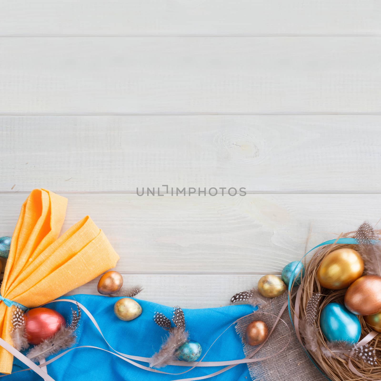 Happy Easter border frame with copy space for text top view flat lay of easter nest fith eggs feathers ribbons bows and fabric folded to rabbit ears