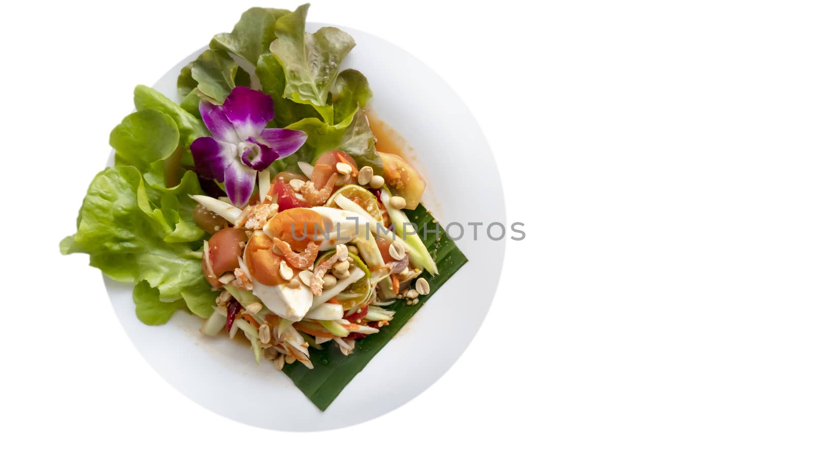 Traditional thai cuisine spicy green papaya salad with salted egg