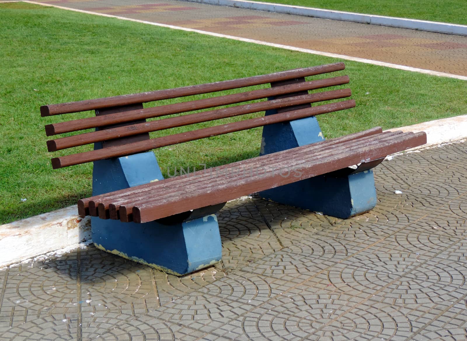 A wooden bench in the city park