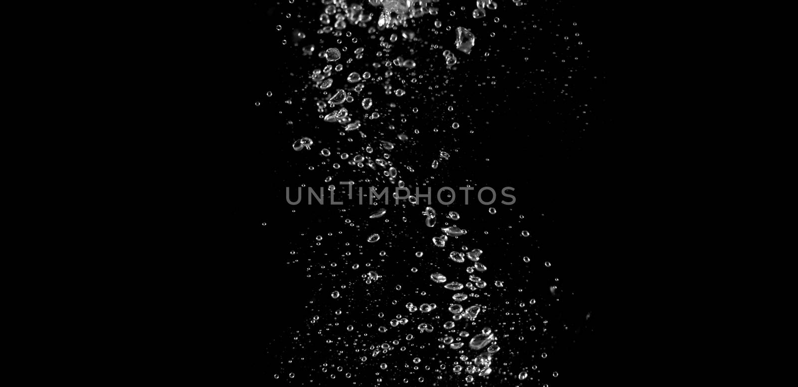 Blurry images of soda liquid water bubbles or carbonate drink or oil shape or beer fizzing or splashing and floating drop in black background for represent sparkling and refreshing