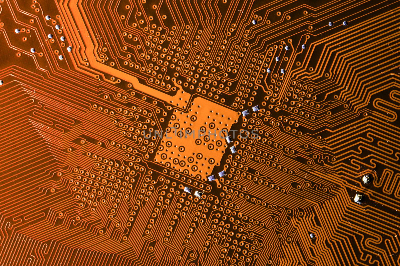 Close up photo of orange pcb printecd circuit board electric paths by petrsvoboda91