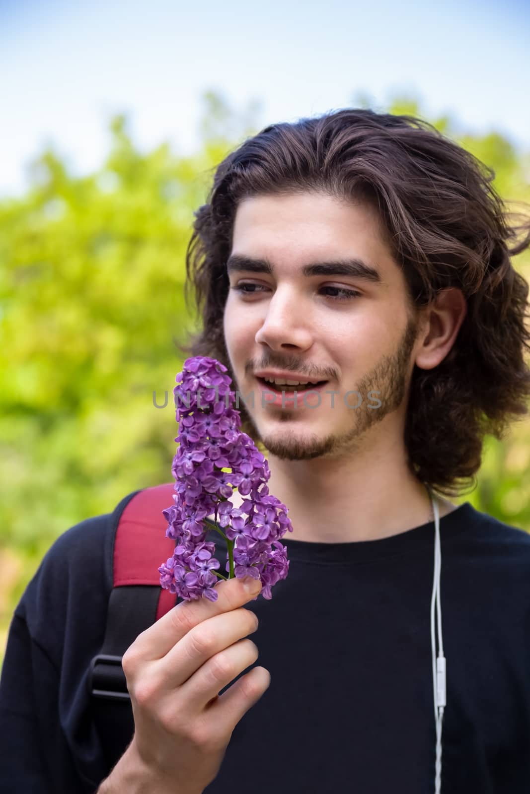 Man smelling lilac twig by Anelik