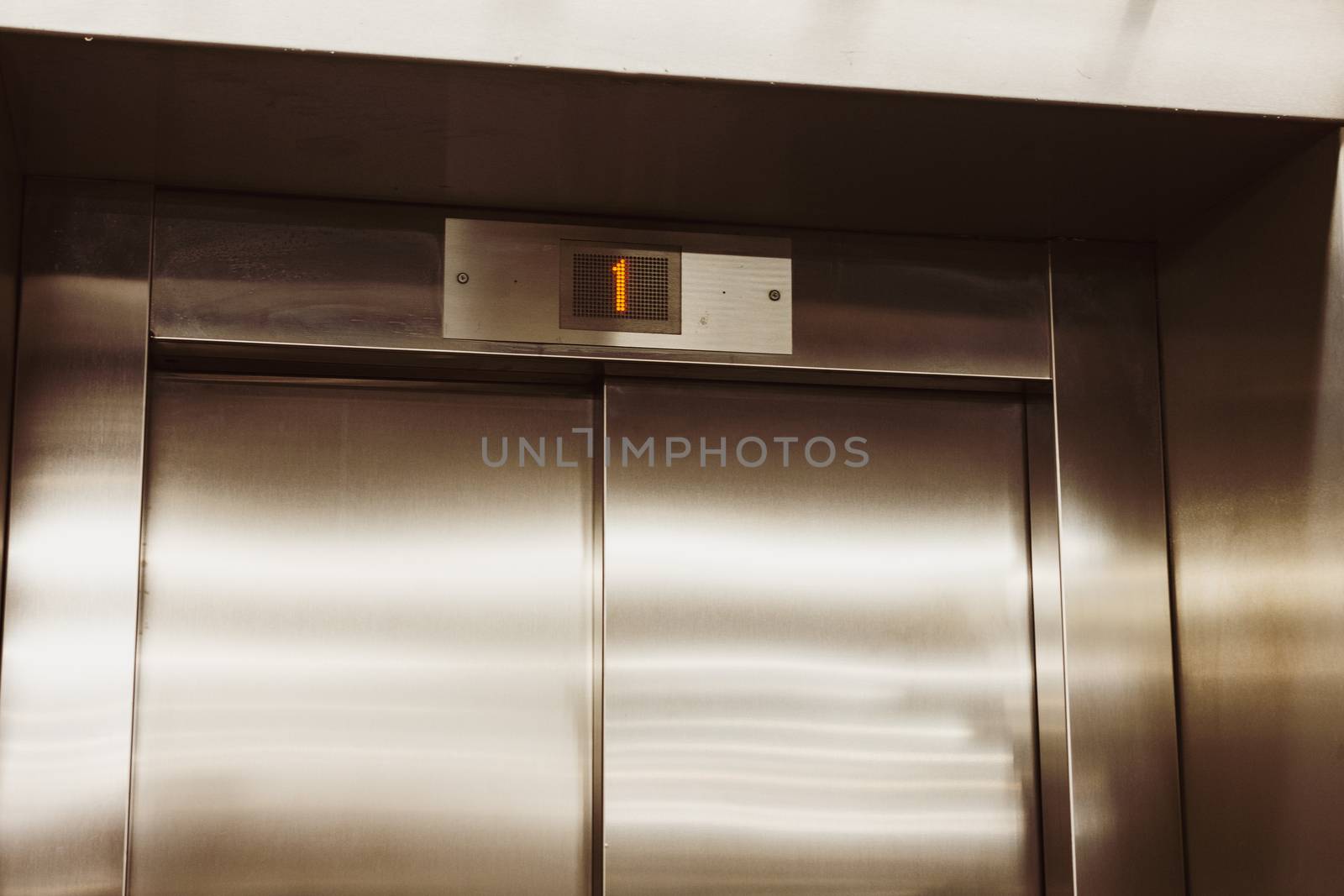 Closed door of the lift. Elevator on the first floor. by mirekpesek