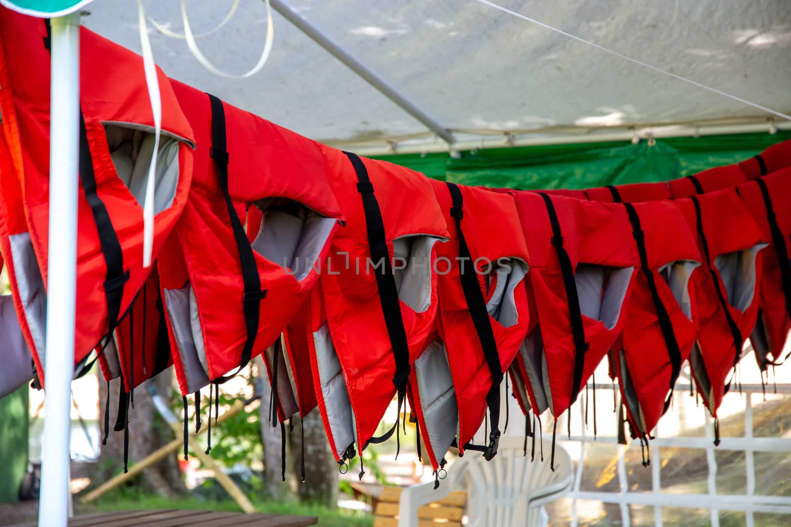 Life jackets drying in the shed. by fotorobs