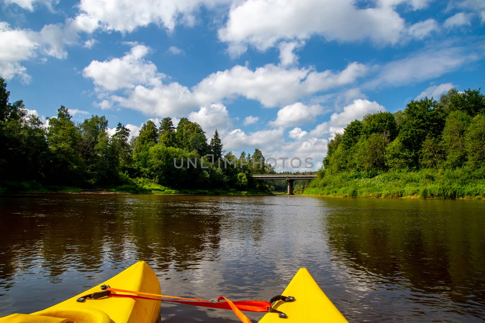 Kayak and canoe ride in river Gauja in Latvia. Boat ride by the river. Beautiful view of river from boat. The Gauja is the longest river in Latvia, which is located only in the territory of Latvia. Length - 452 km.

