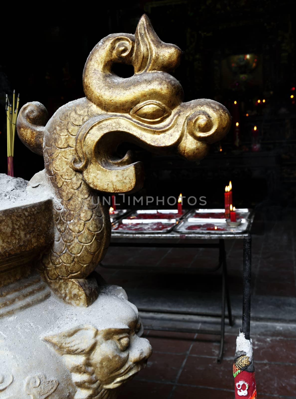 Dragon head - detail of a decorative incence burner in a Vietnamese temple