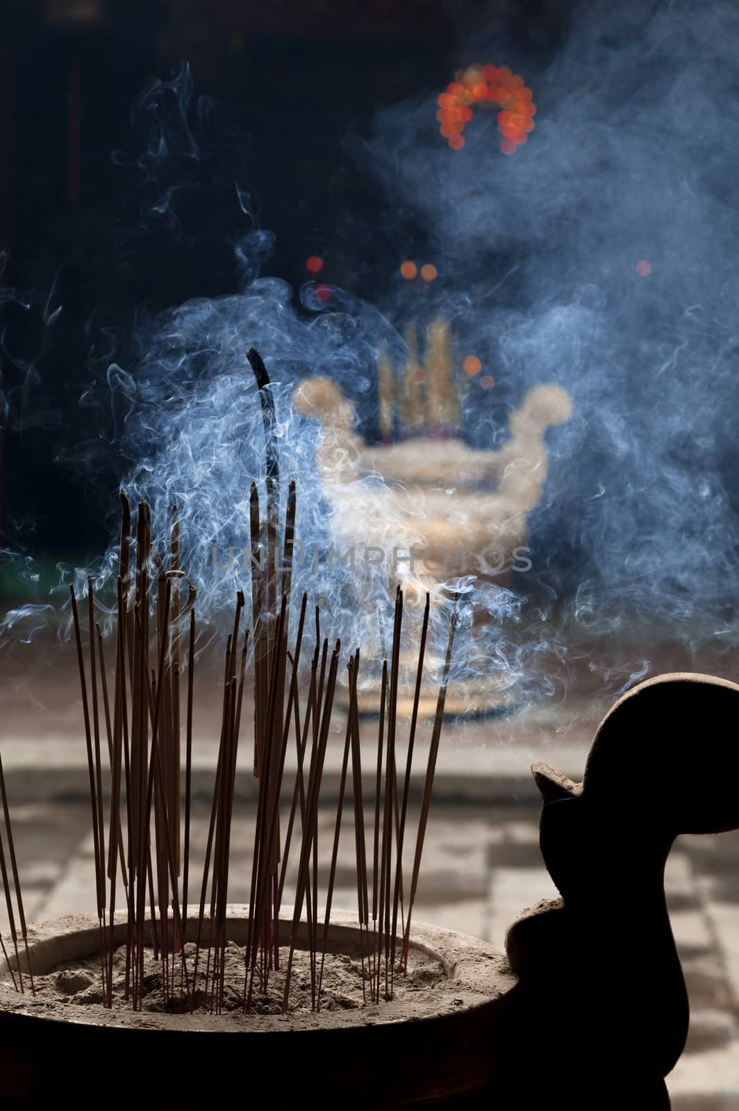 Burning incence sticks in a Buddhist temple