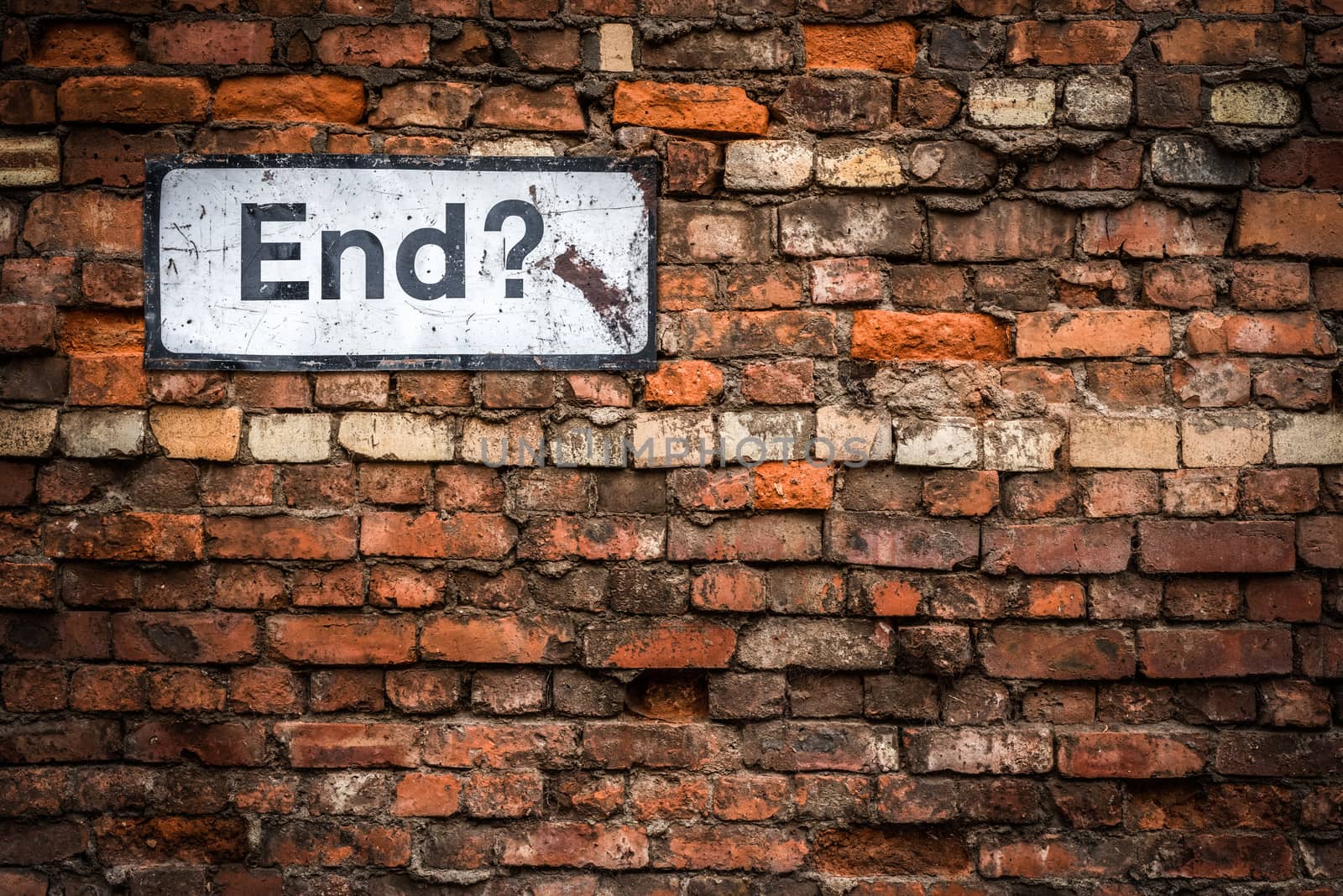 Uncertainty Concept Image Of A Grungy Sign Saying End? On An Old Red Brick Wall