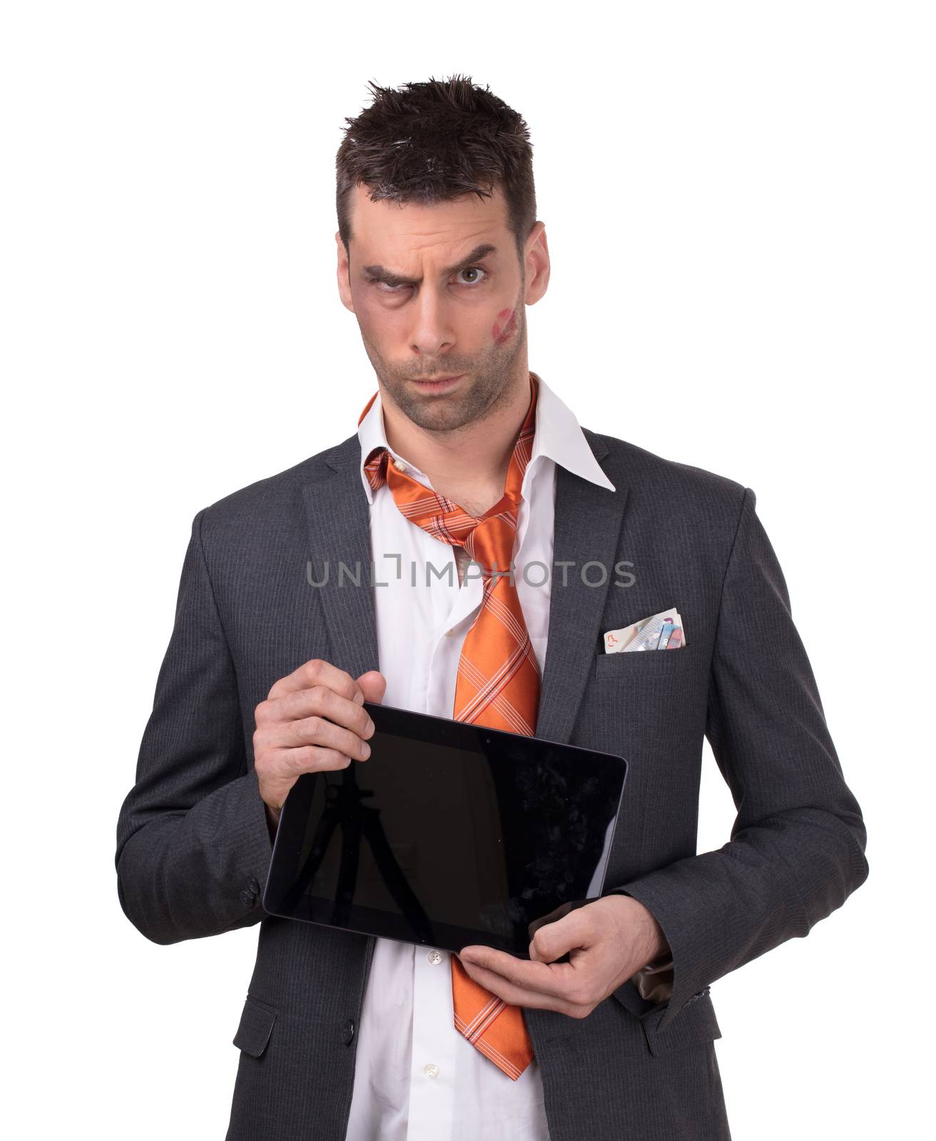 Beaten business man, tablet in hand, isolated on white