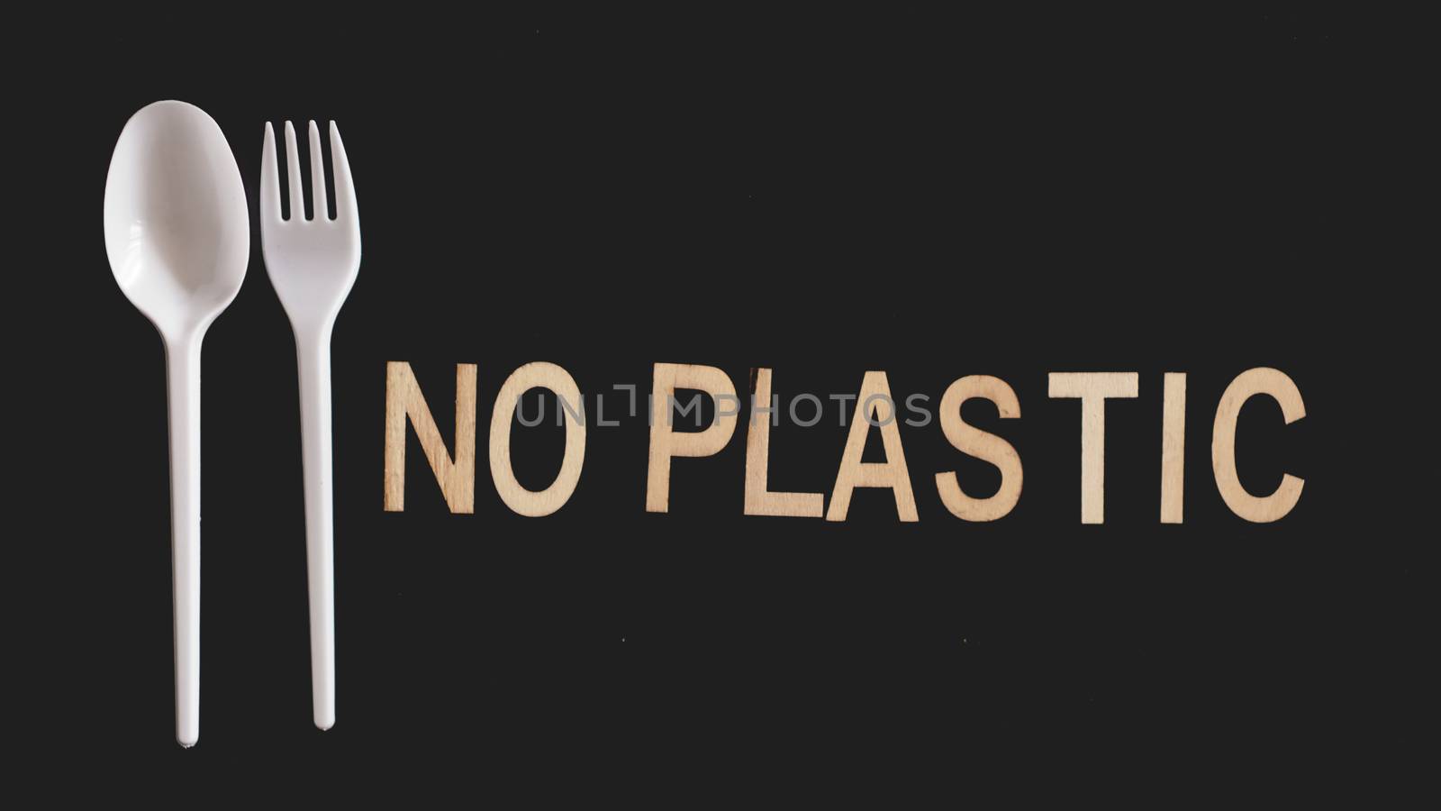 Say No Plastic Cutlery, Plastic Pollution and Environmental Protection Concept, Top View on black background