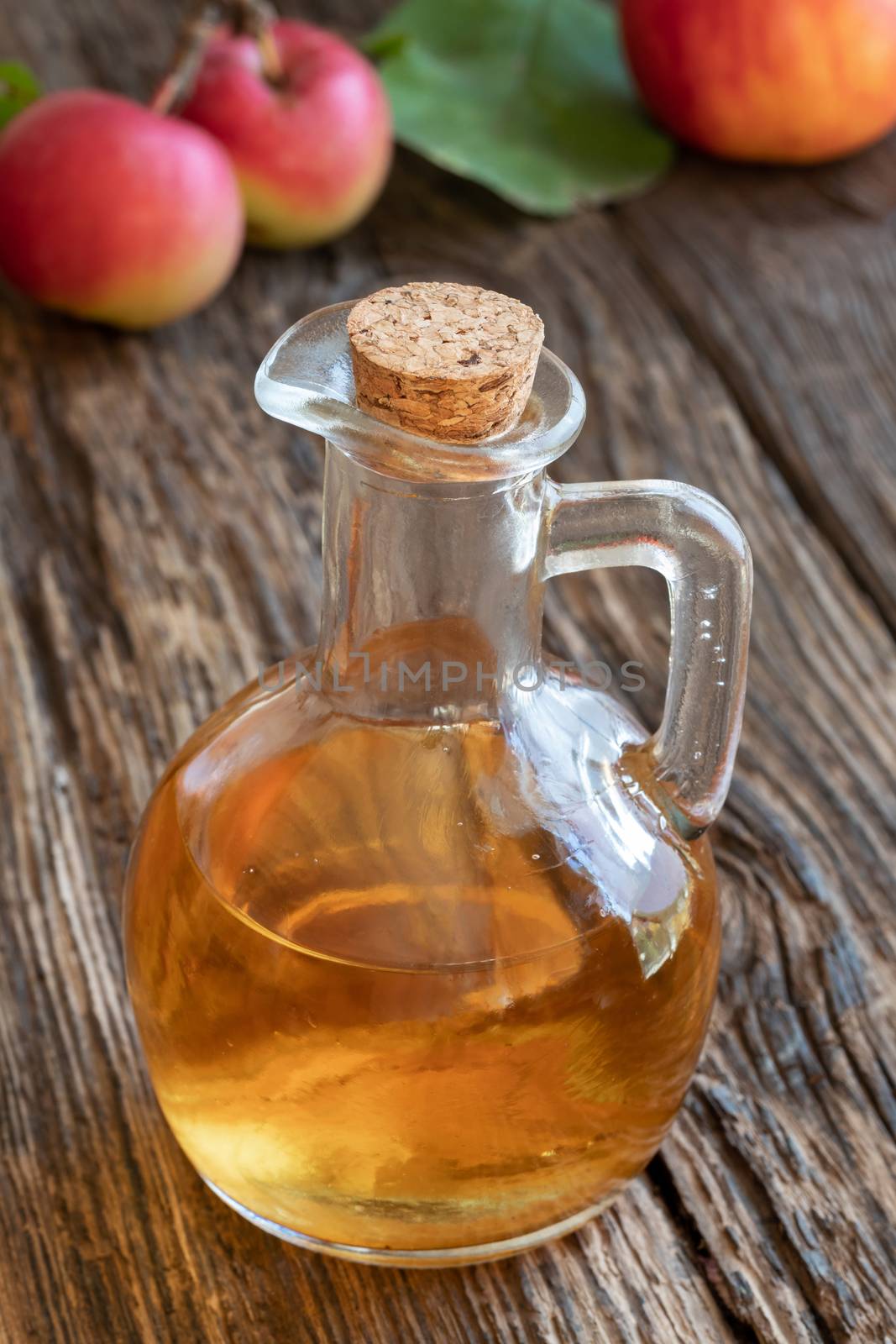 A bottle of apple cider vinegar on a table