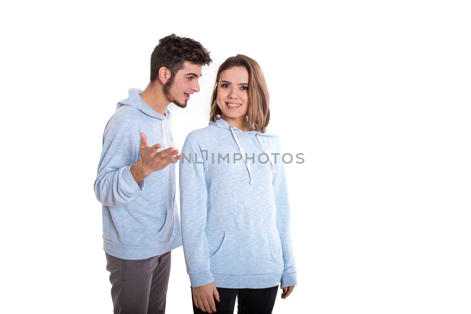 Man disputing with smiling woman, couple isolated on white
