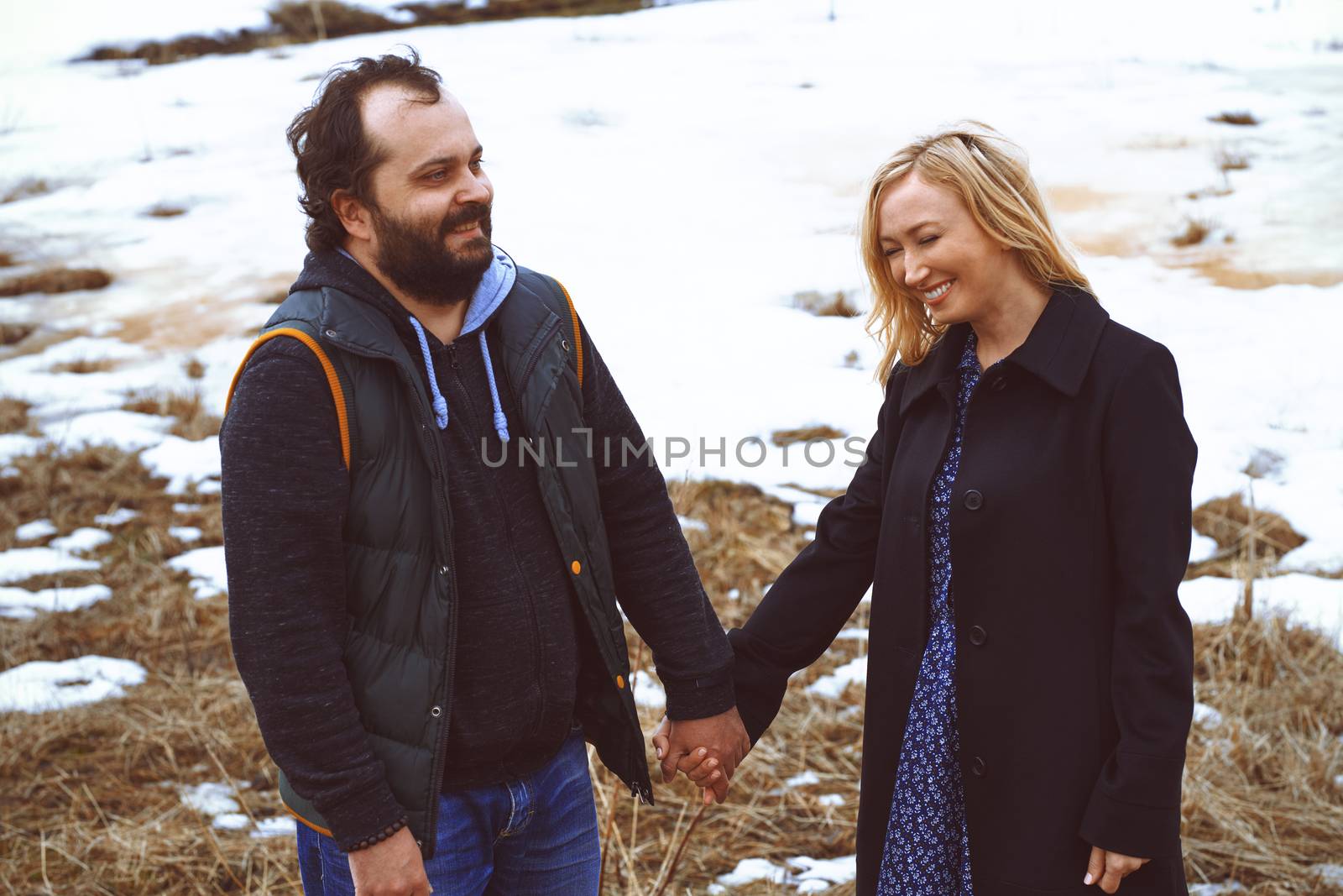 Couple having fun in the winter landscape