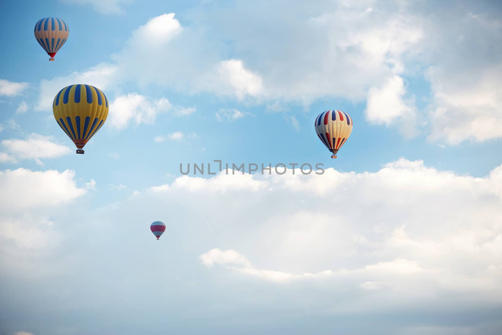 Group of air balloons flying in the sky by Novic