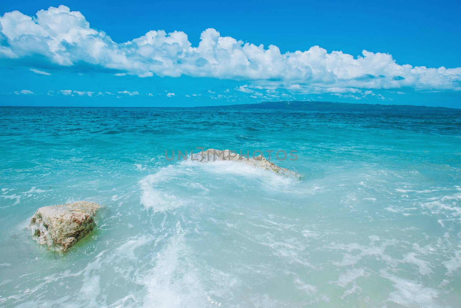 Beautiful summer sea landscape with transparent water and island on background