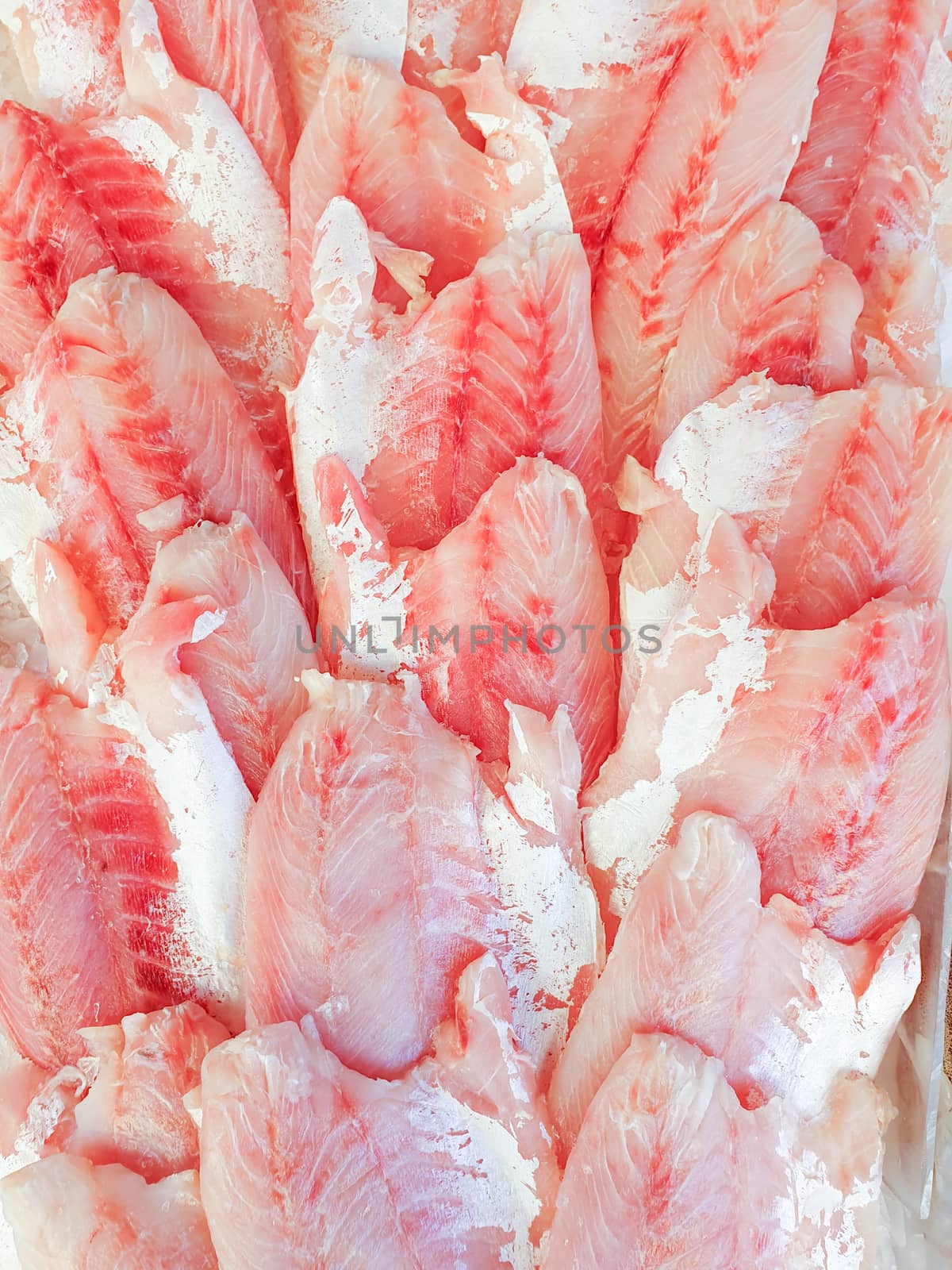 African perch fillet on ice for sale, Fish local market stall with fresh water fish,view from top.