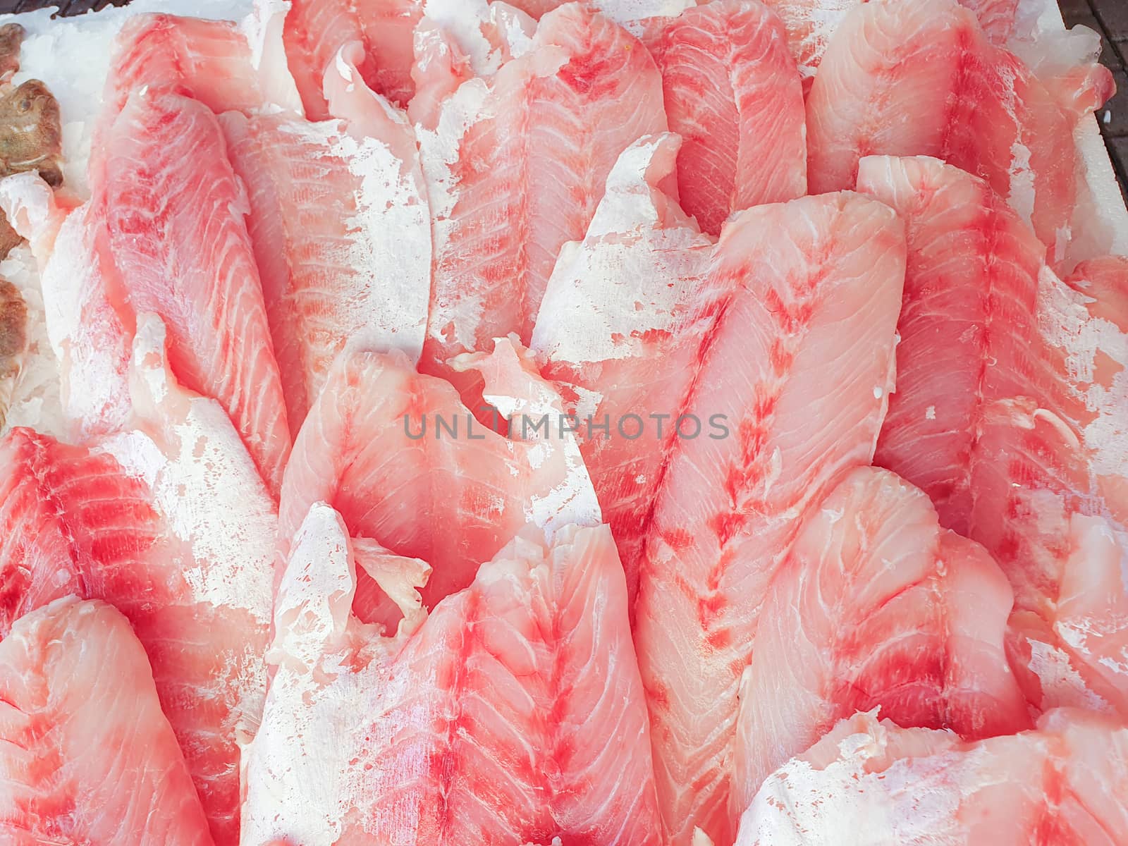 African Perch fillet on ice close up by Robertobinetti70