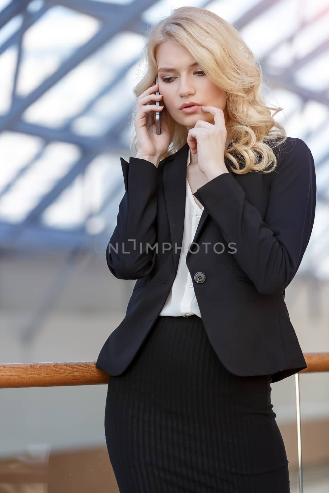 Business woman talking on phone by ALotOfPeople