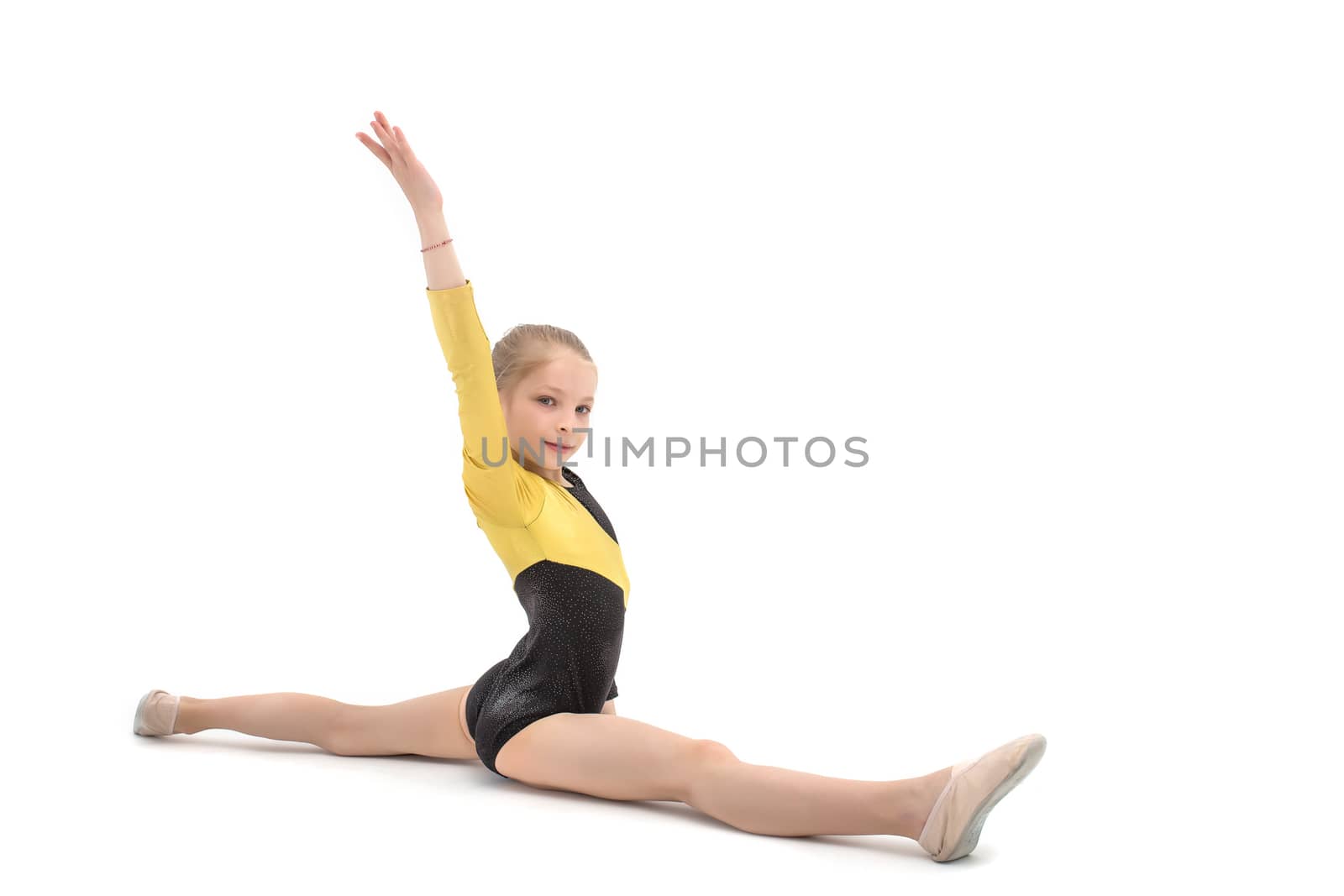 Acrobatics teenage girl sitting in cross split isolated on white