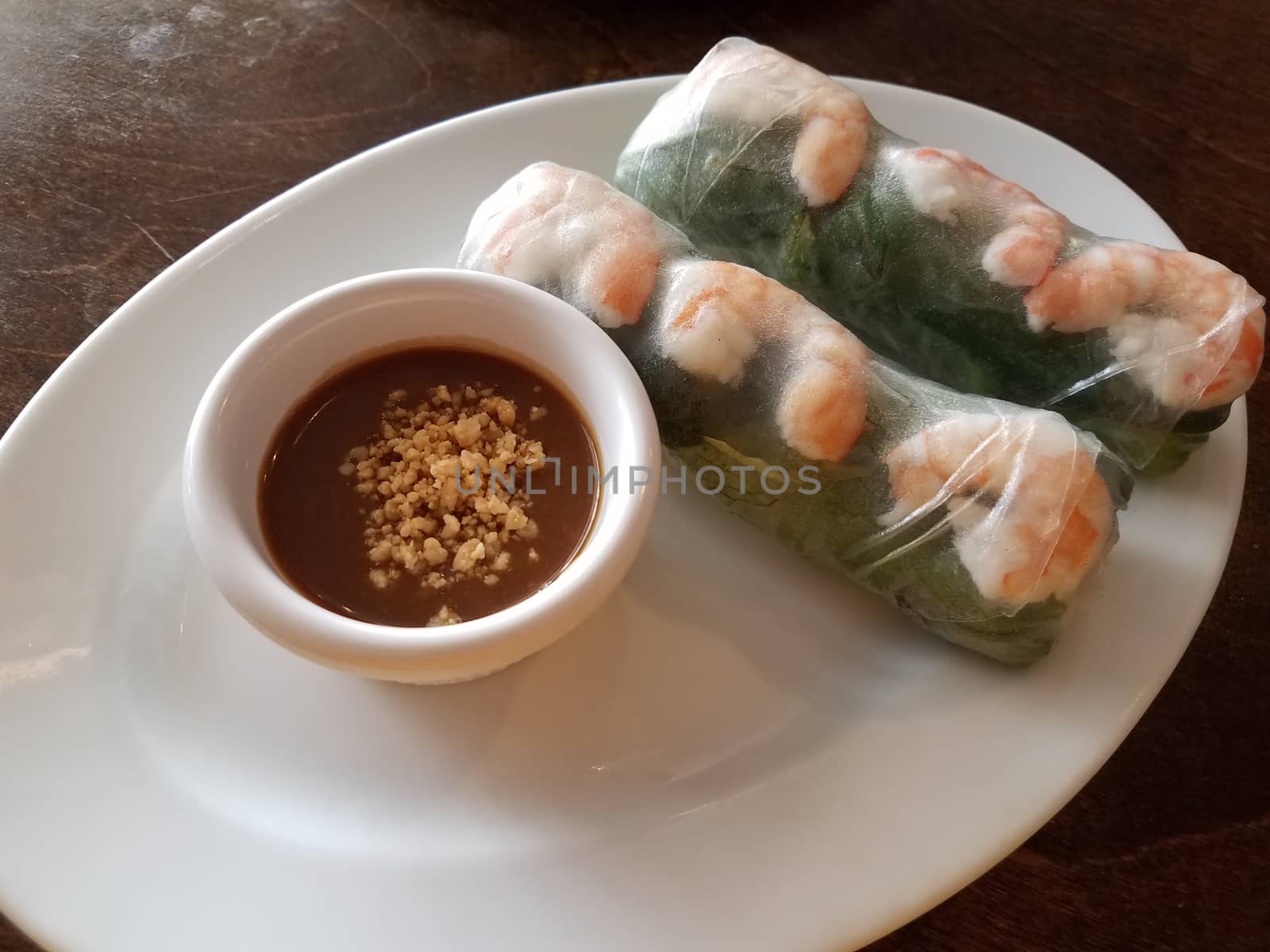 Vietnamese rice paper rolls with shrimp and peanut dipping sauce