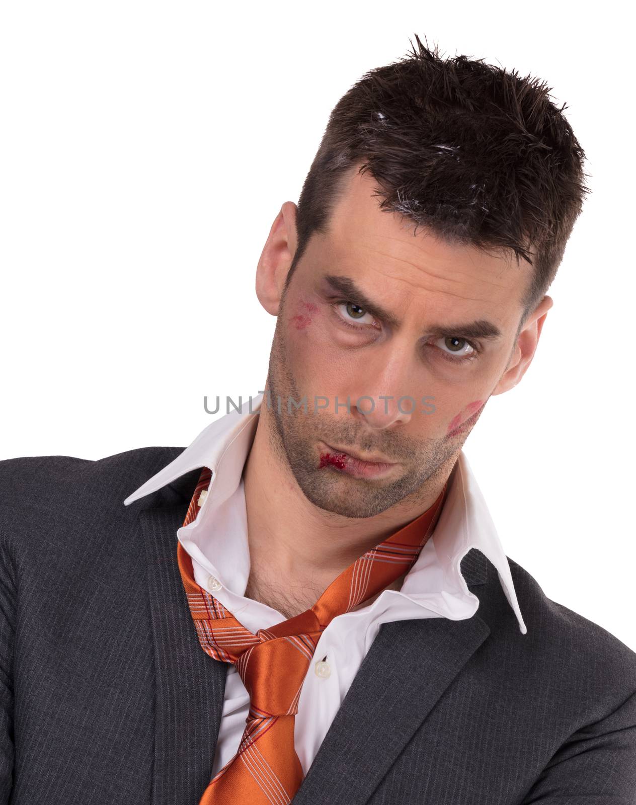 Close up of a businessman with bloody lip, beaten and bruised, isolated