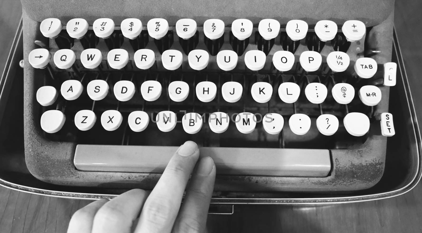 Old typewriter machine in good condition with no paper in feed for use in the past job career such as write office document, copywriter, author, news journalist, secretary, creative and more. 