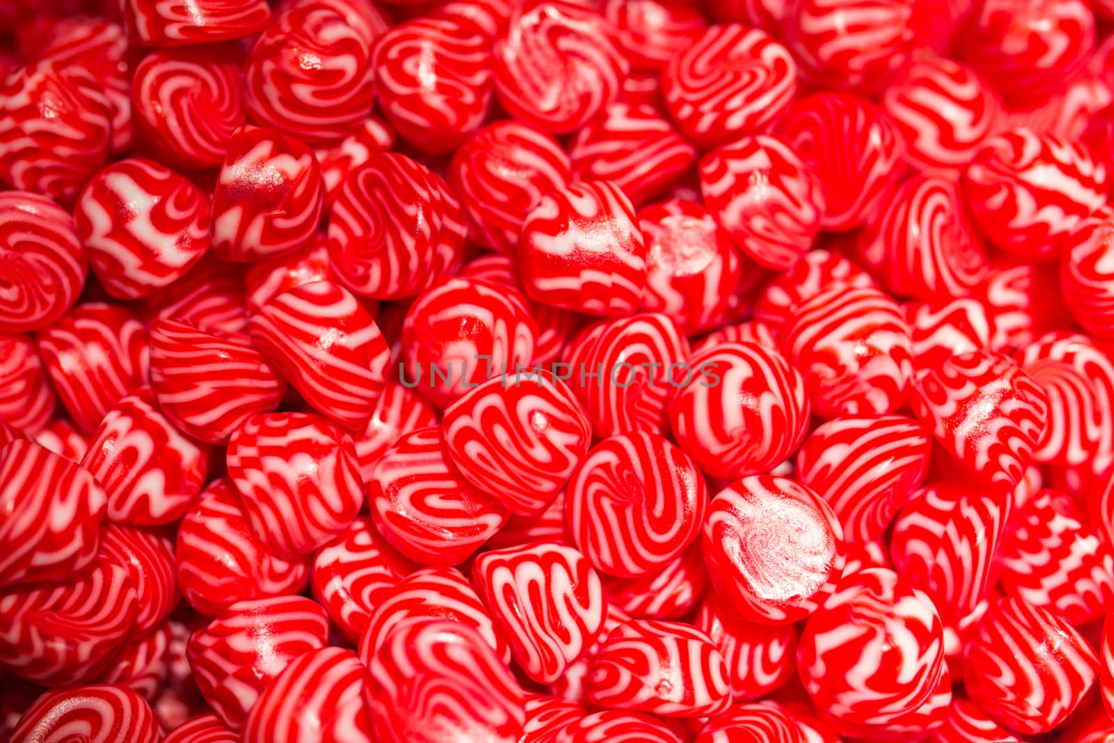 A macro shot of red sweet candy.