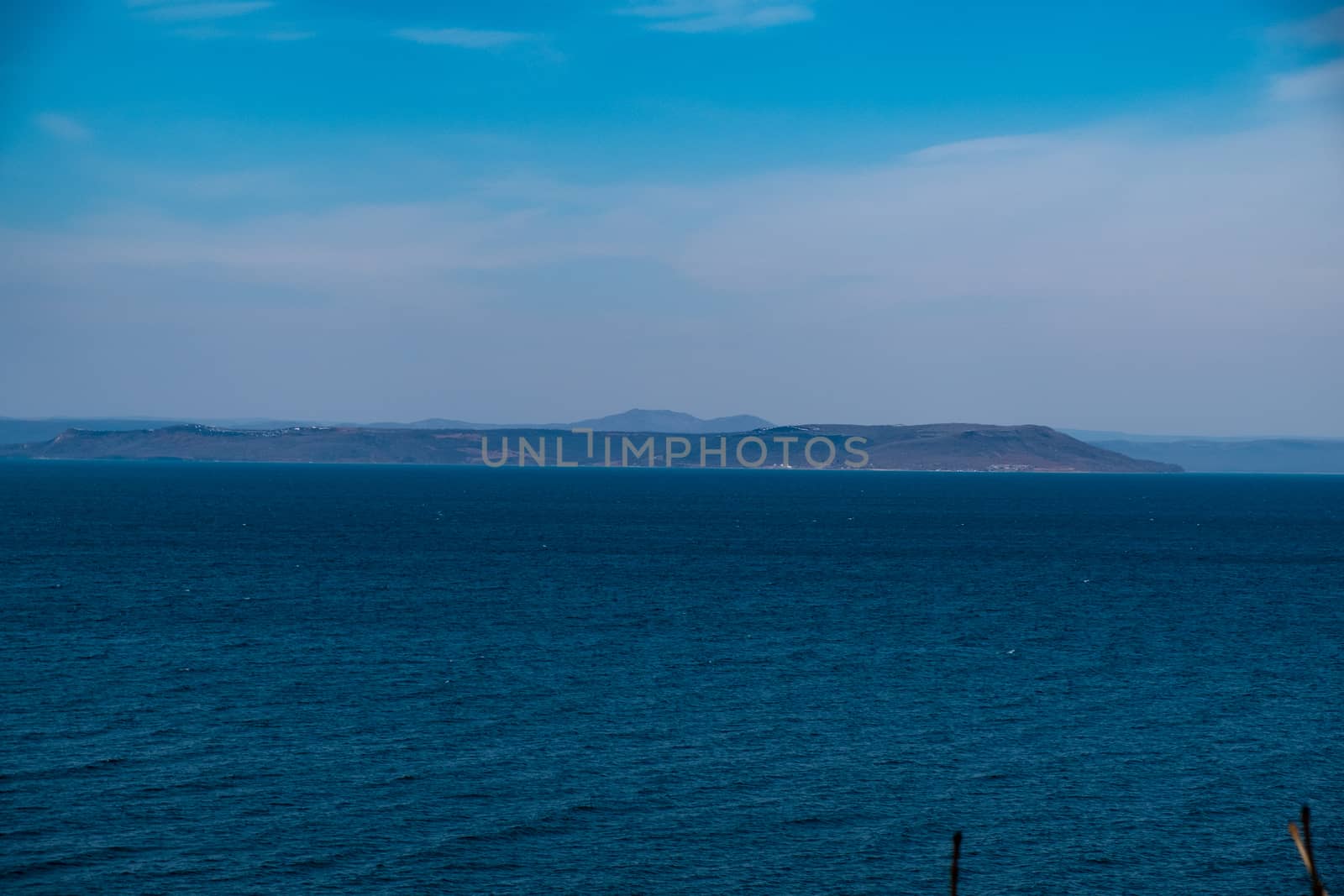 Sea view from the city of Vladivostok. Mountains on the other side of the sea.