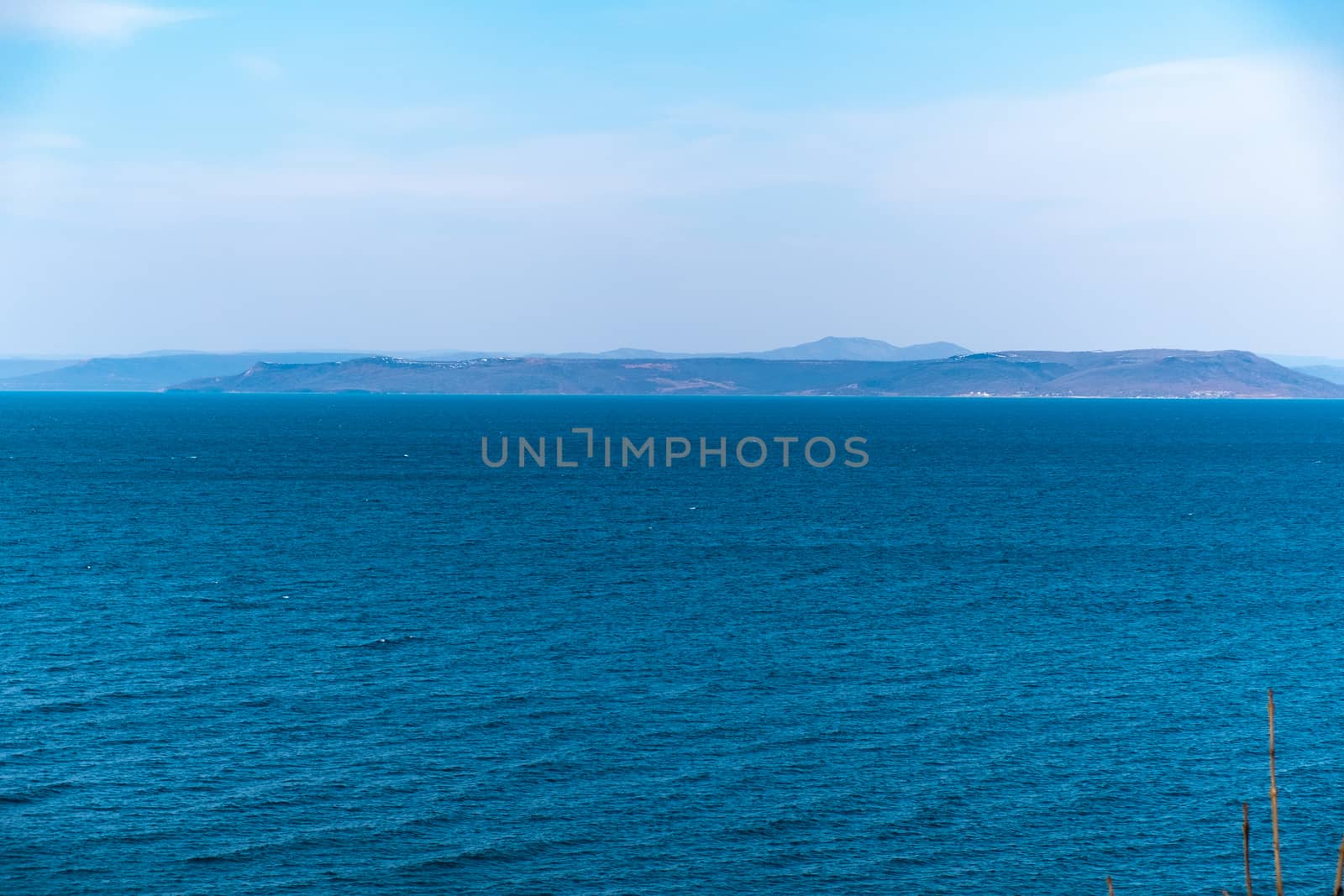 Sea view from the city of Vladivostok. Mountains on the other side of the sea.