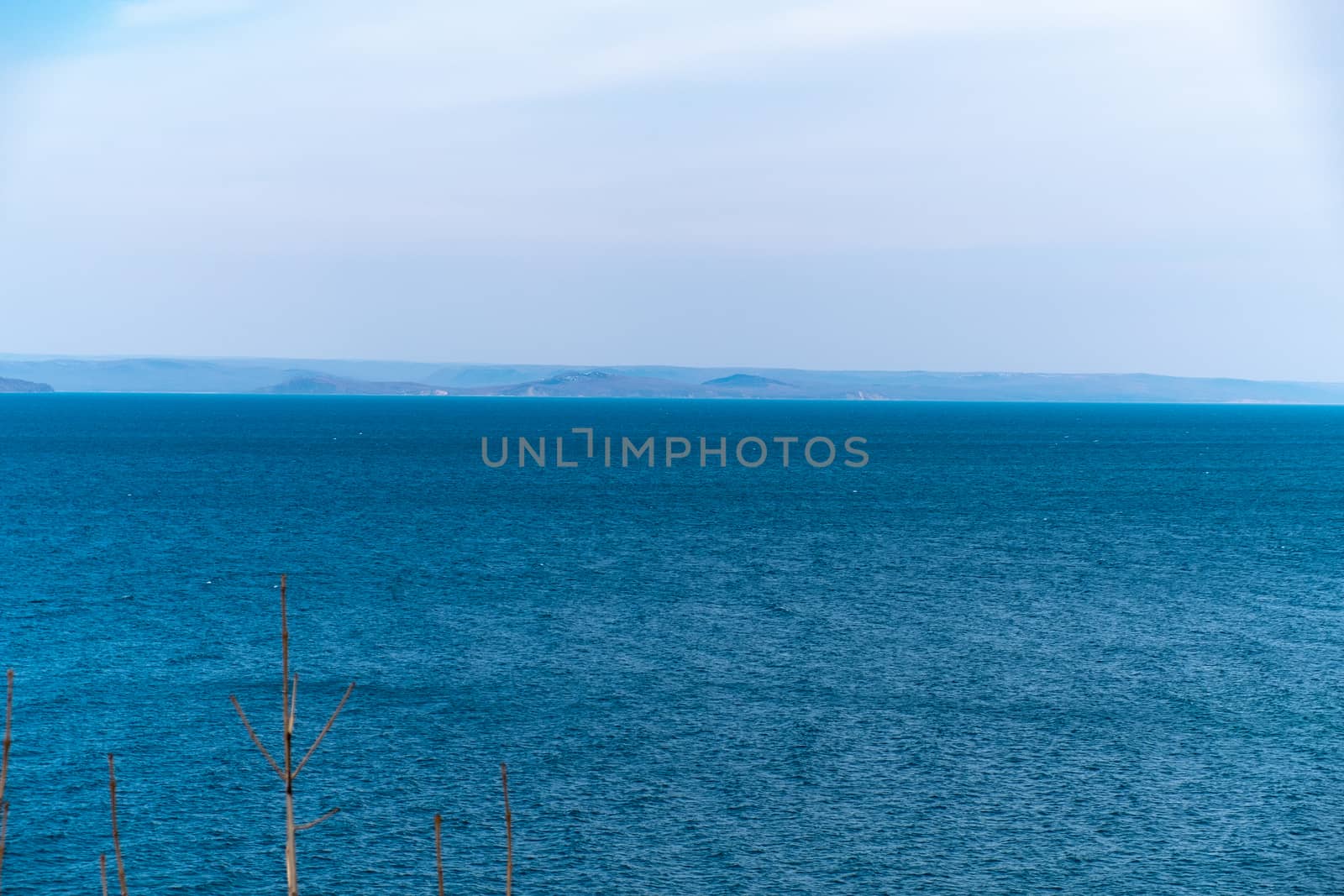 Sea view from the city of Vladivostok. Mountains on the other side of the sea.