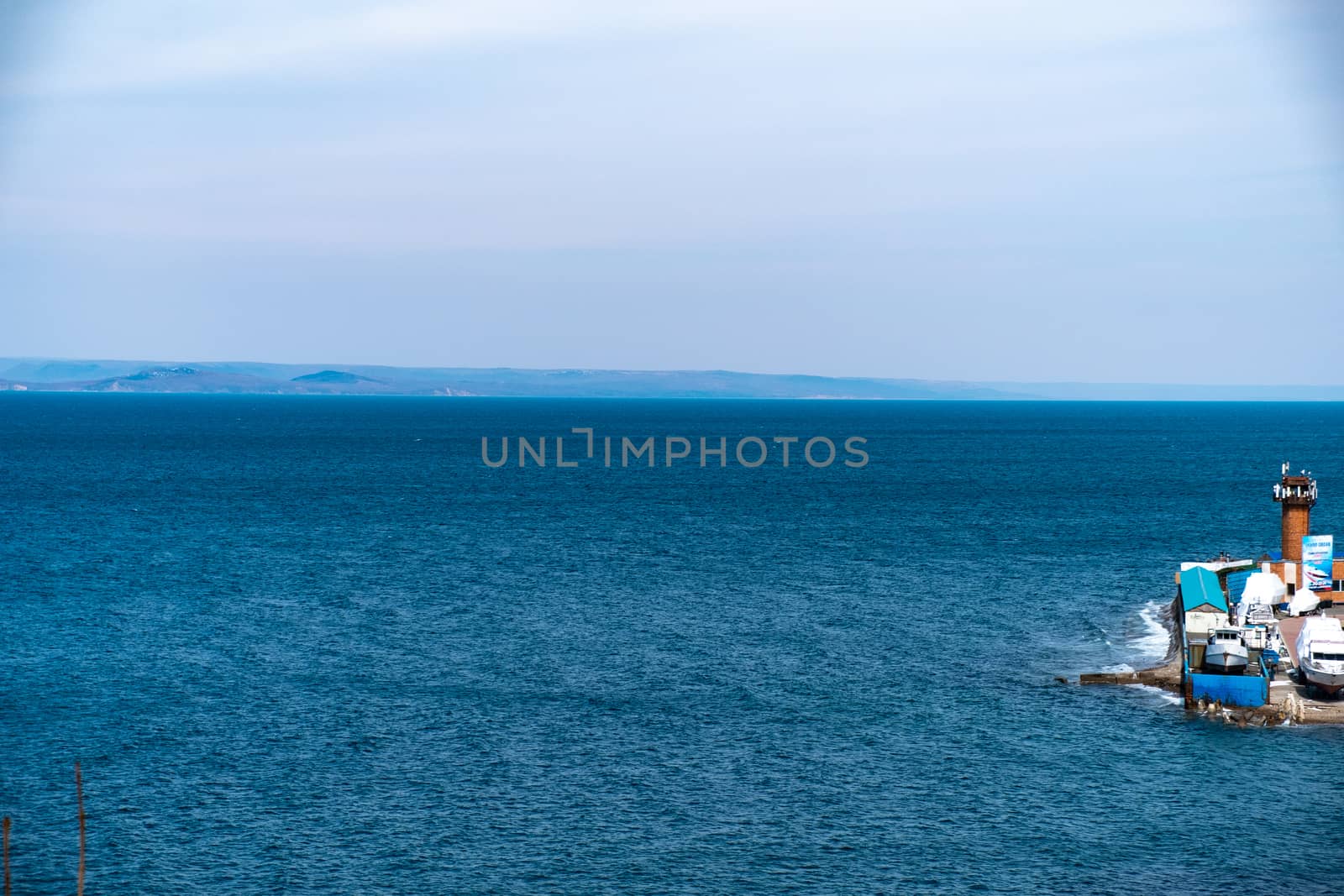 Vladivostok, Russia - 24 March, 2019: View of the city embankment and amusement park by rdv27