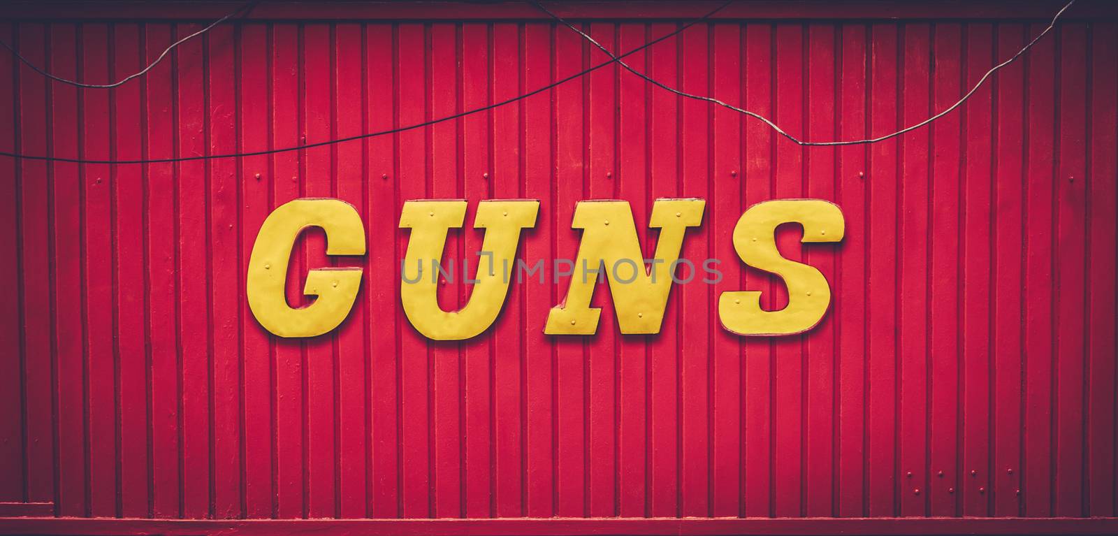 A Retro Red Gun Store Sign In The USA