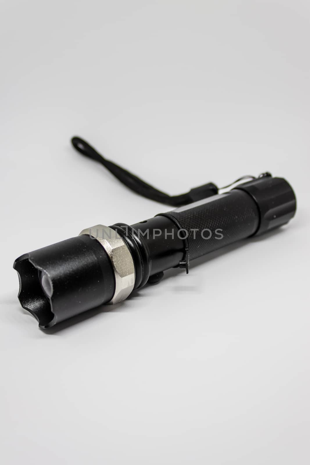 a closeup flashlight shoot with white background. shoot has taken with photobox.