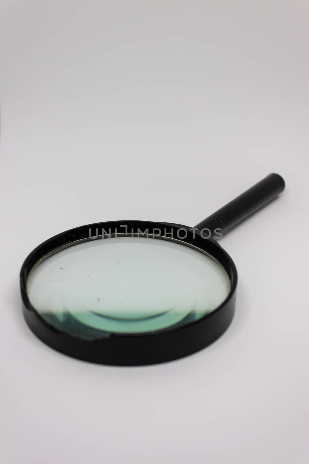 a closeup shoot from magnifying glass with white background.