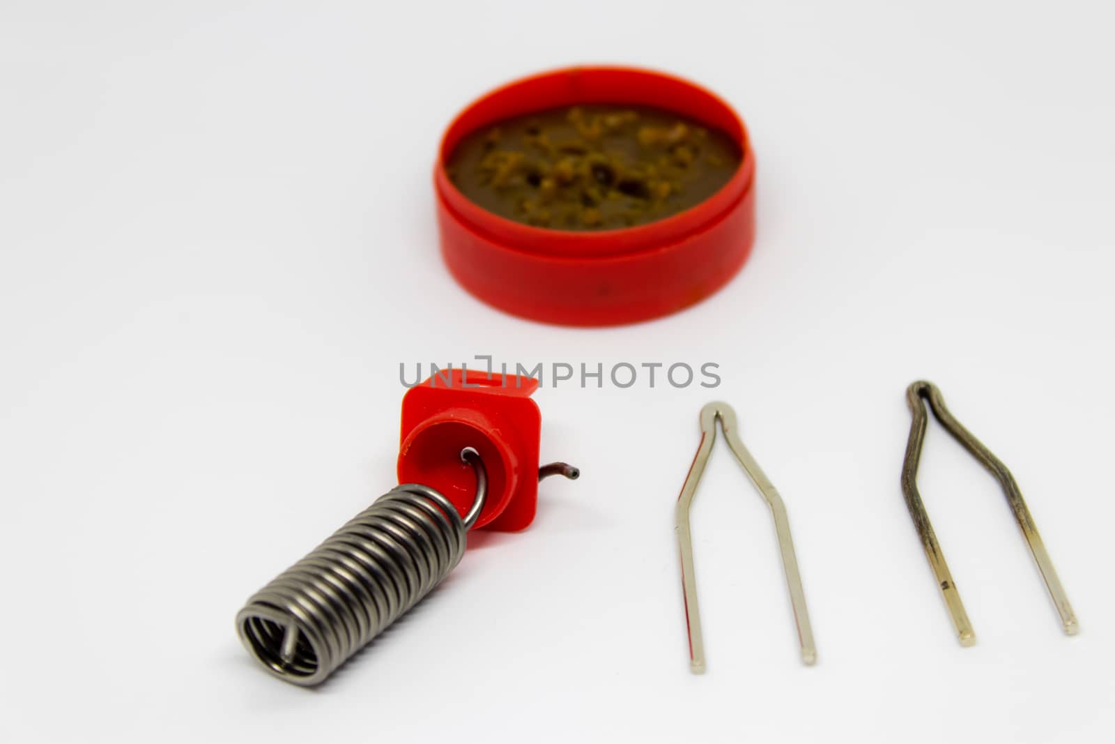 coil spring and grease closeup shoot with white background. photo has taken as product photo.