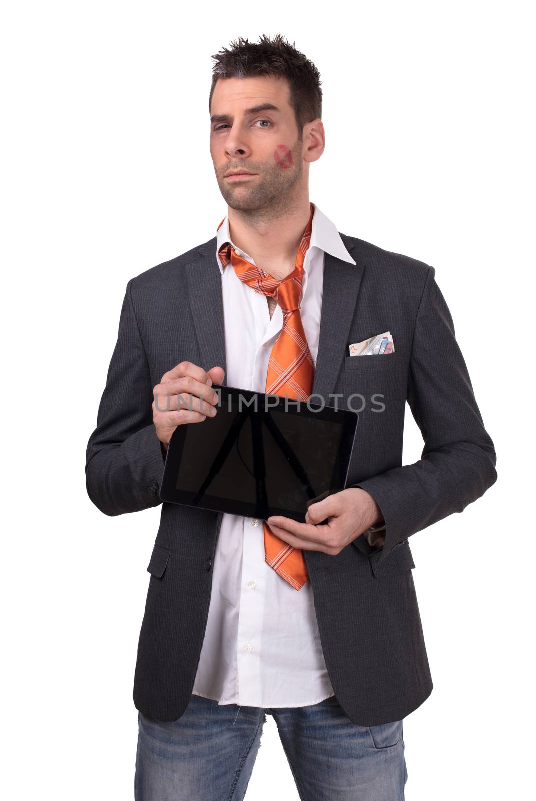 Beaten business man, tablet in hand, isolated on white