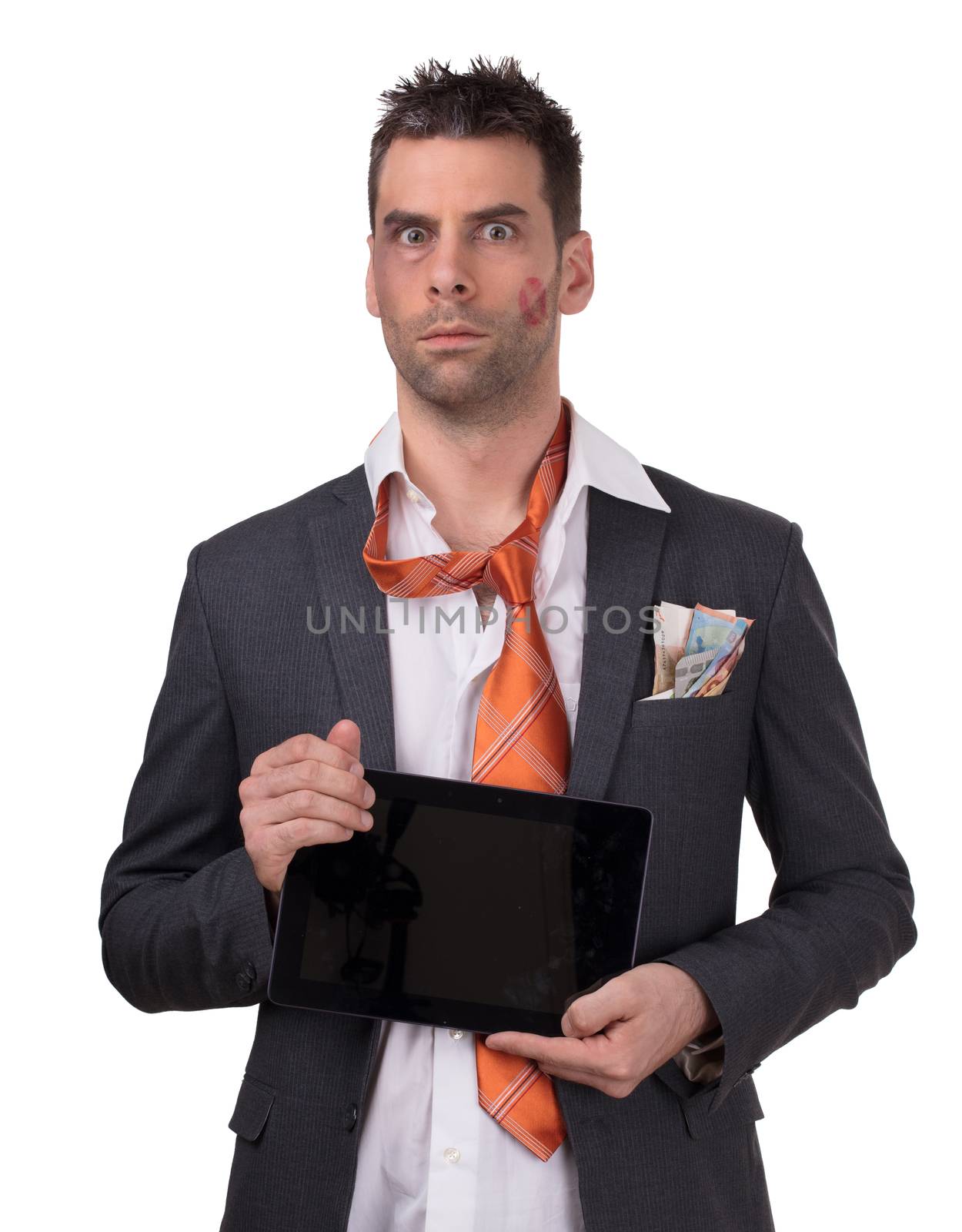Beaten business man, tablet in hand, isolated on white