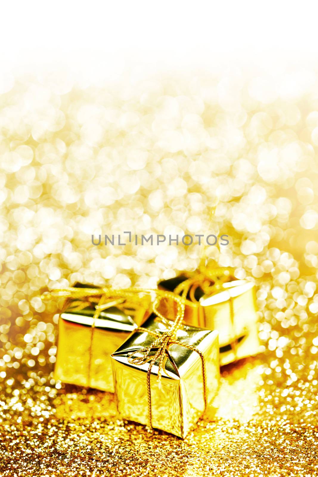 Decorative holiday gift boxes on bright shiny background
